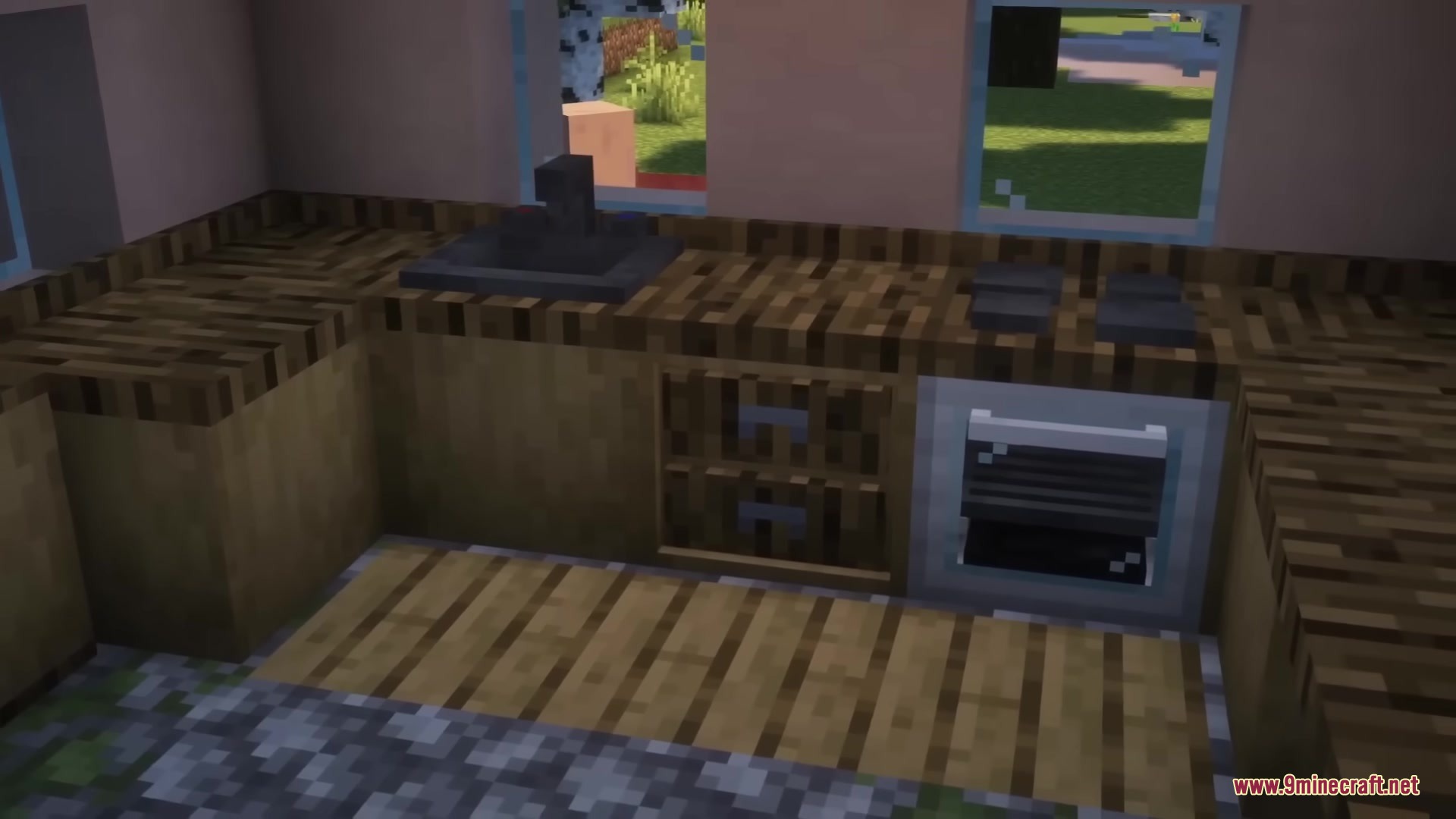 A detailed Minecraft kitchen featuring wooden counters, a sink, and an oven