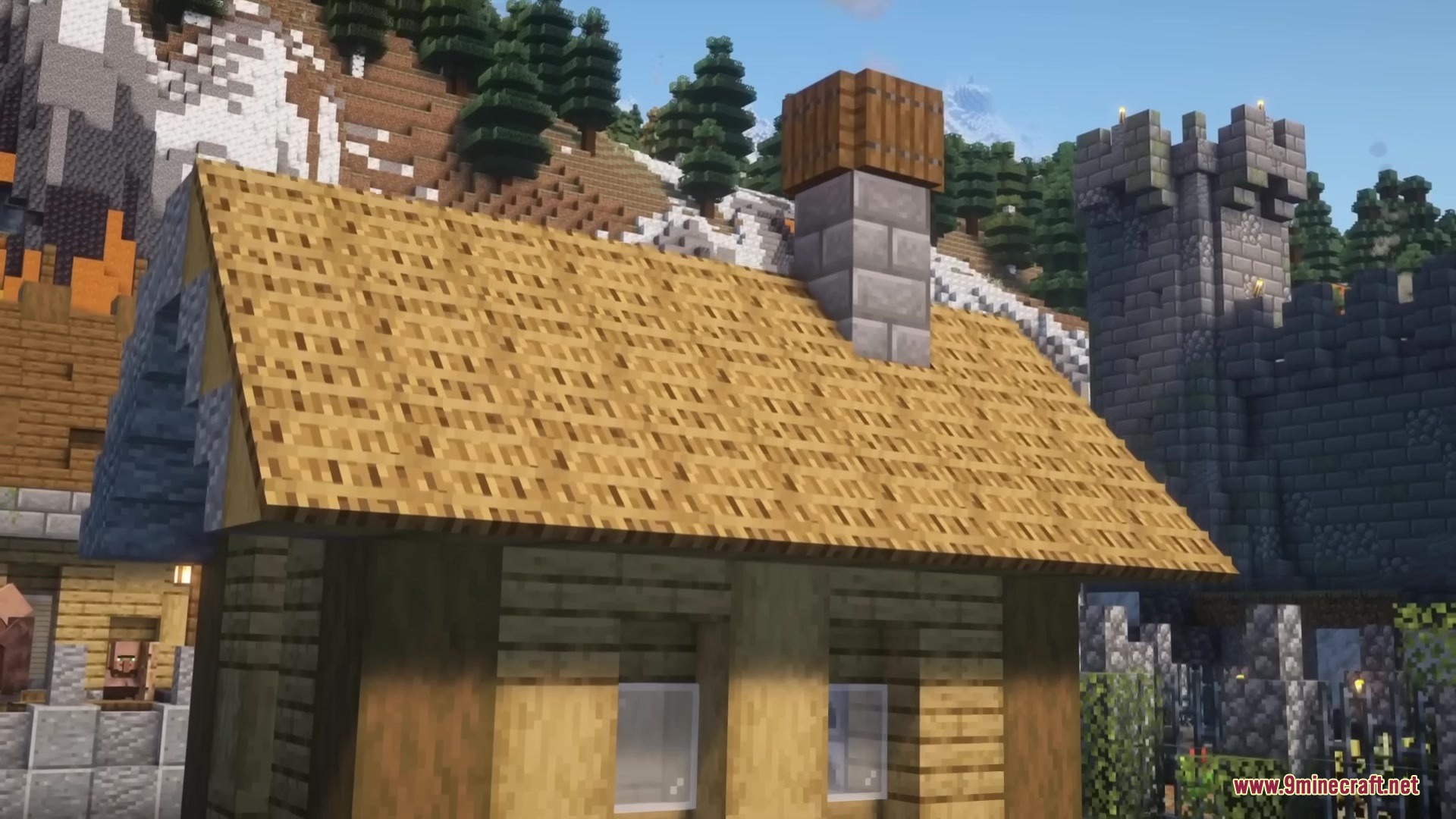 A wooden house with a stone chimney and a castle in the background