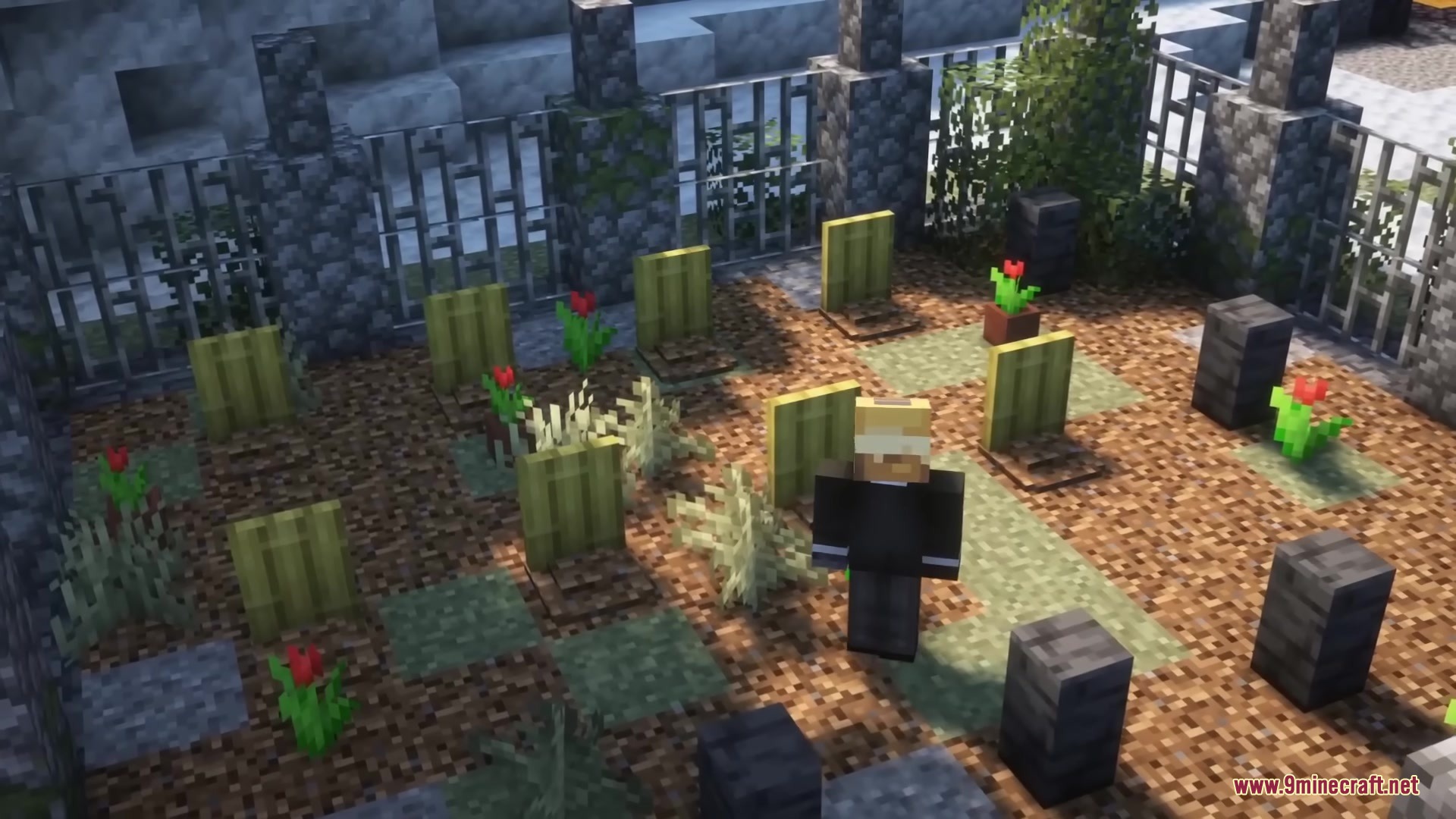 A player character standing in a graveyard with tombstones and red flowers