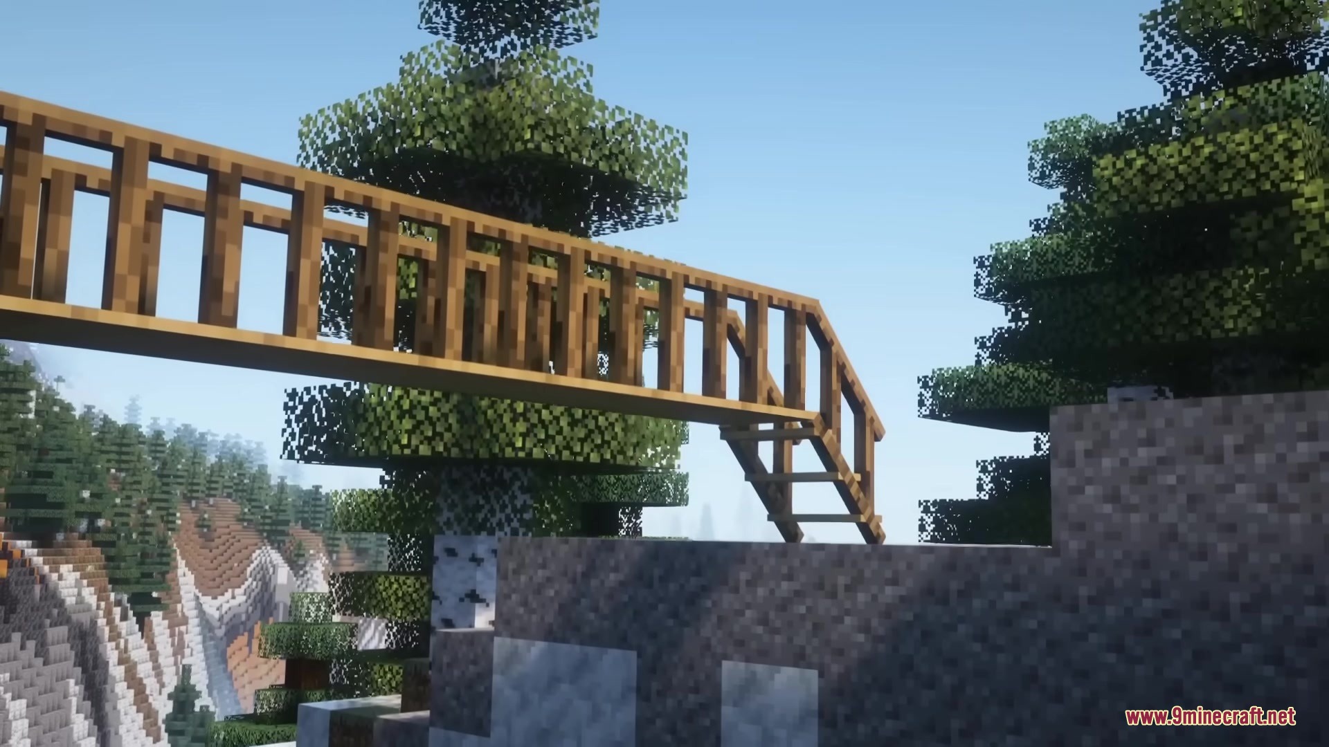 A wooden bridge with railings overlooking a scenic mountain landscape in Minecraft
