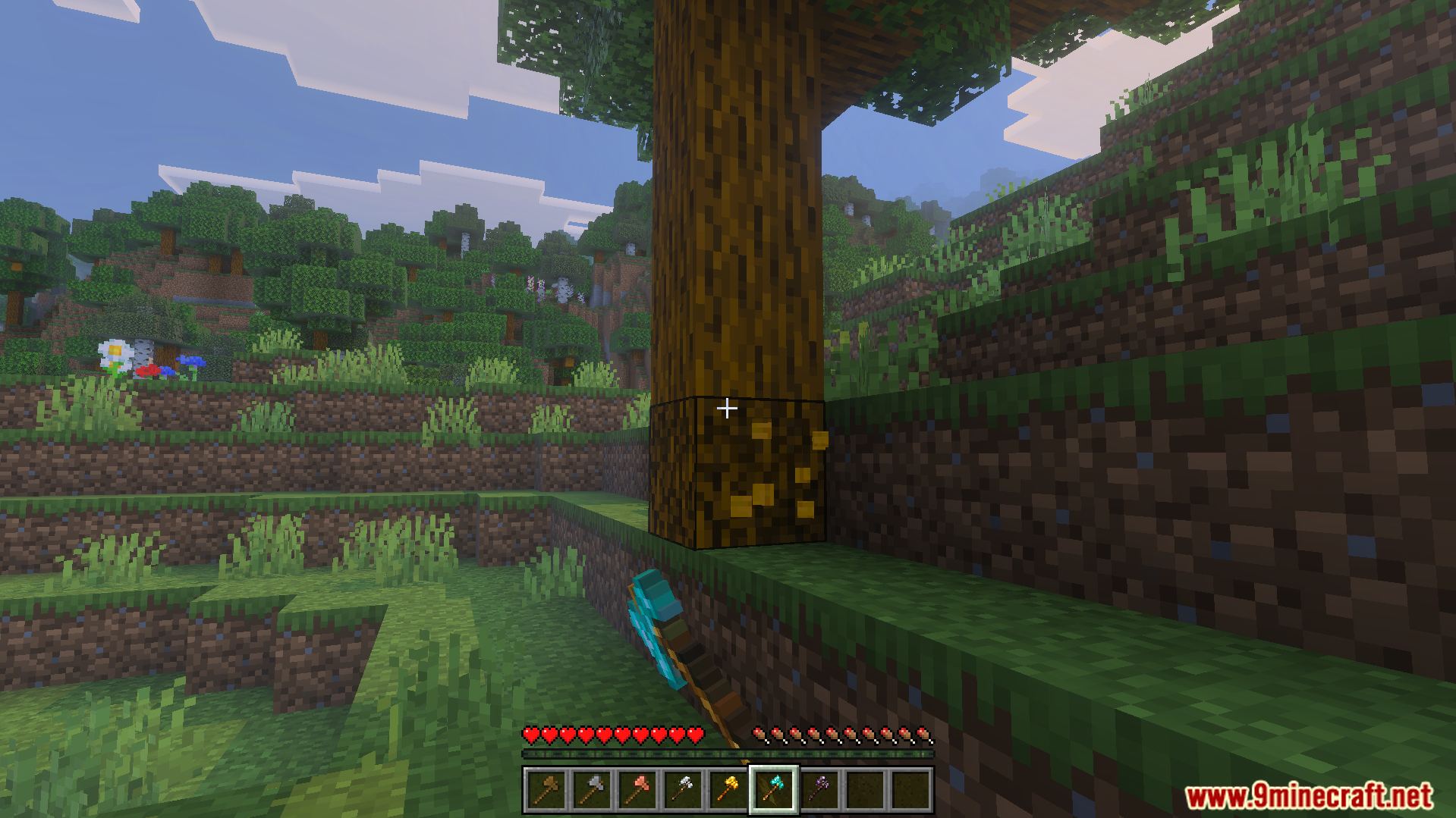 GHs Tree Capitator Addon Screenshot 2 A player breaks the bottom block of a tree using a diamond axe