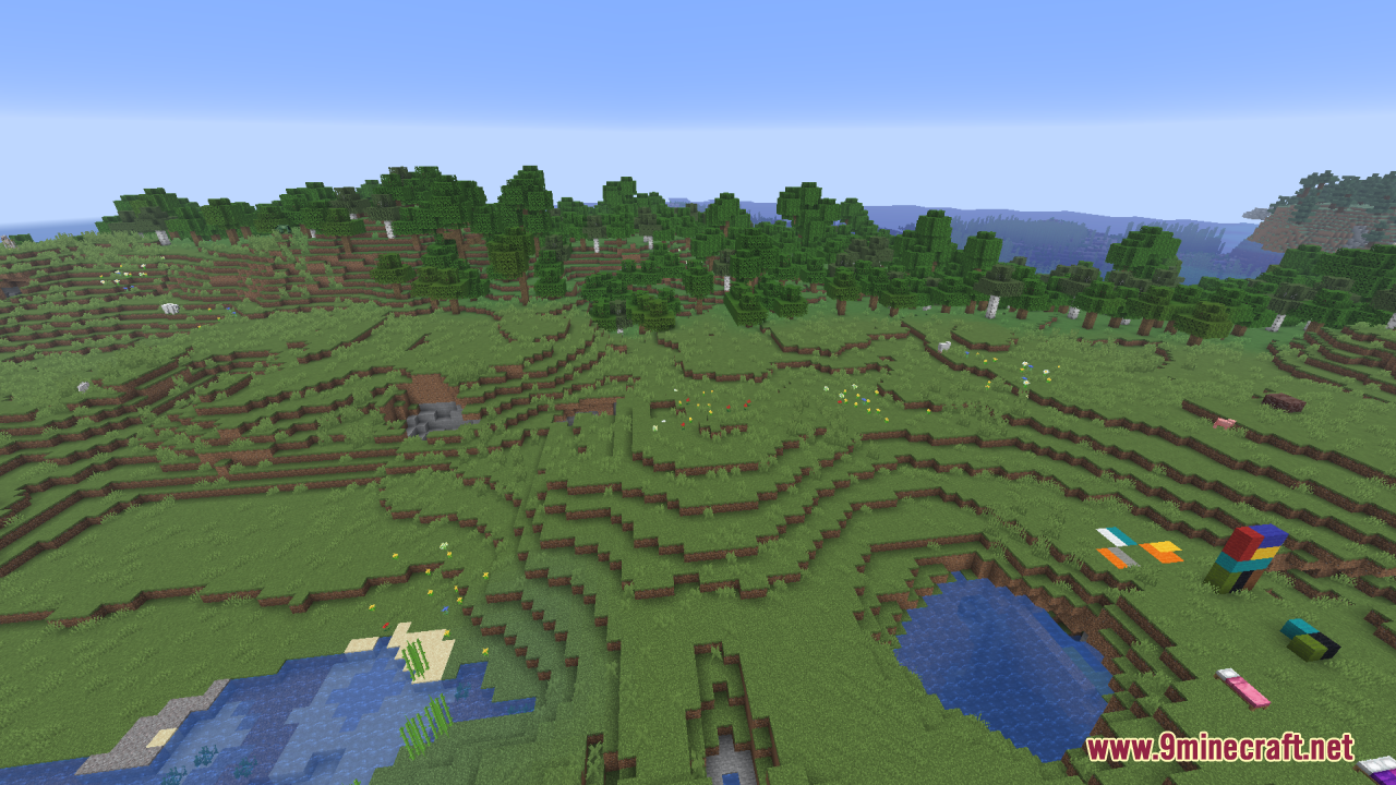 A bright Minecraft landscape with green hills and colorful items on the ground