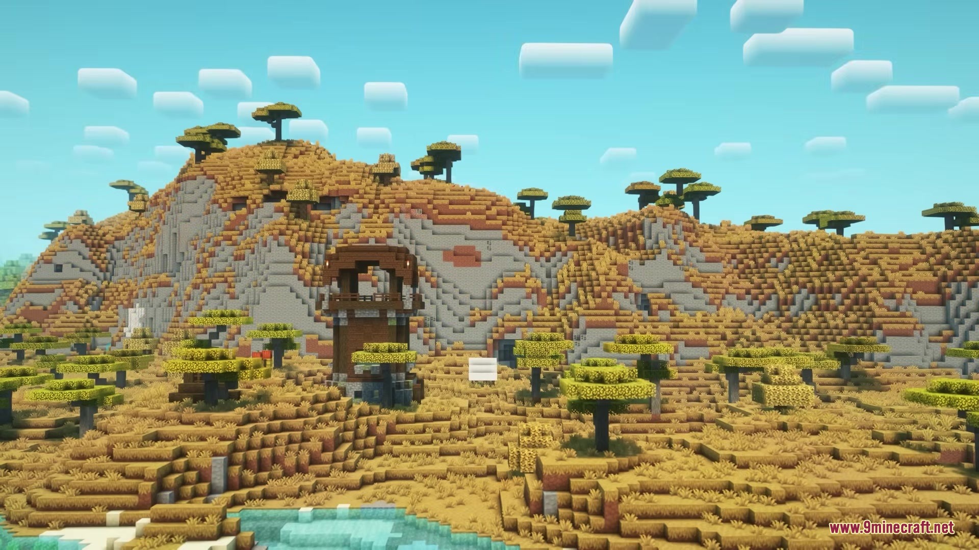 Garden Trails Mod Screenshot 2 A pillager outpost overlooks a vast savanna landscape with scattered acacia trees