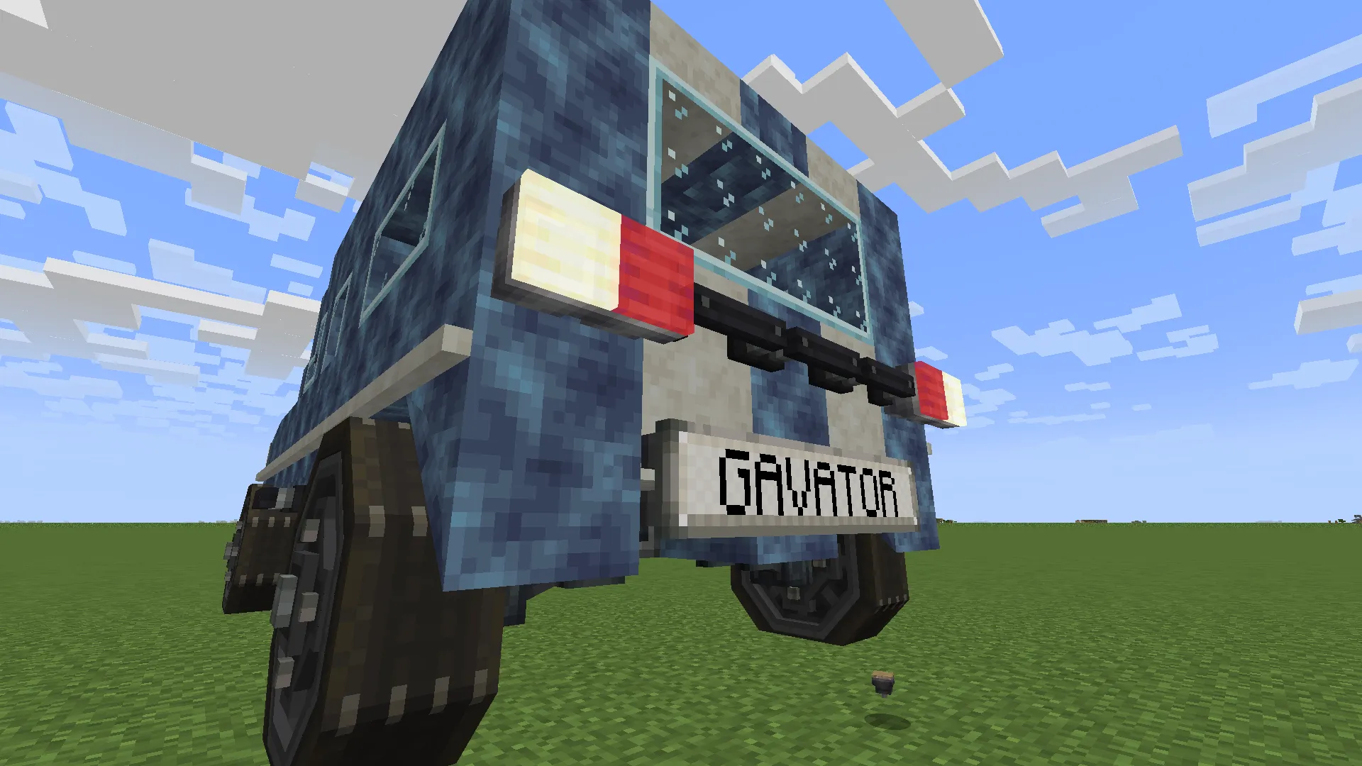 A close up rear view of the blue and white off road vehicle