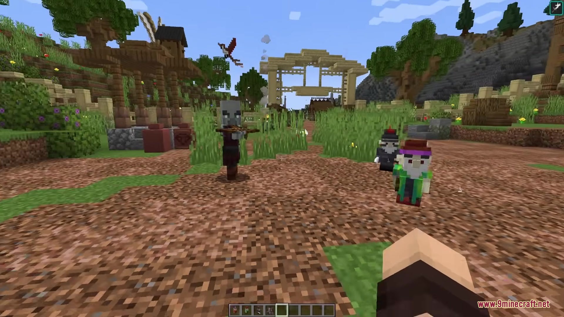Gnyfty Gnomes Mod Screenshot 5 A Pillager aims a crossbow at small gnomes in a village setting
