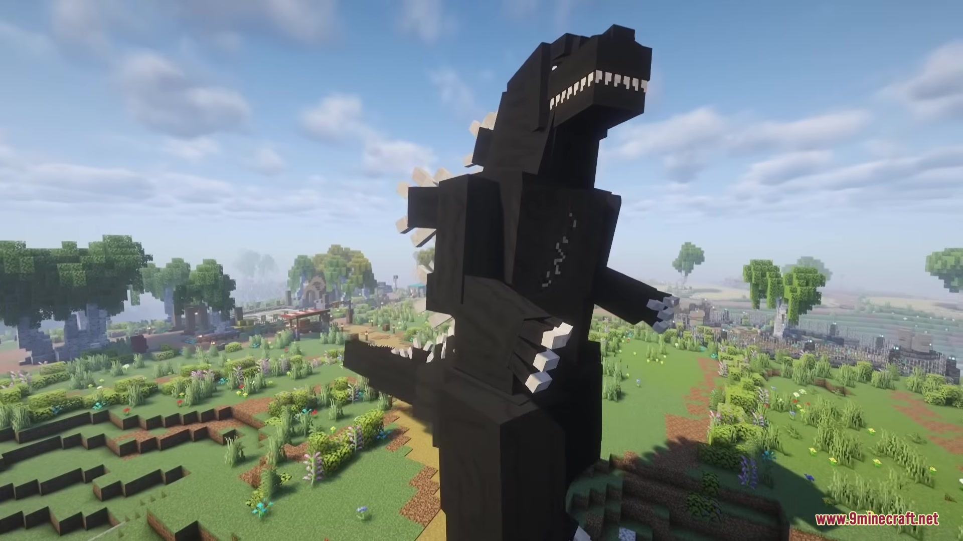 Godzilla Reborn Mod Screenshot 2 A massive black Godzilla model standing in a grassy Minecraft field