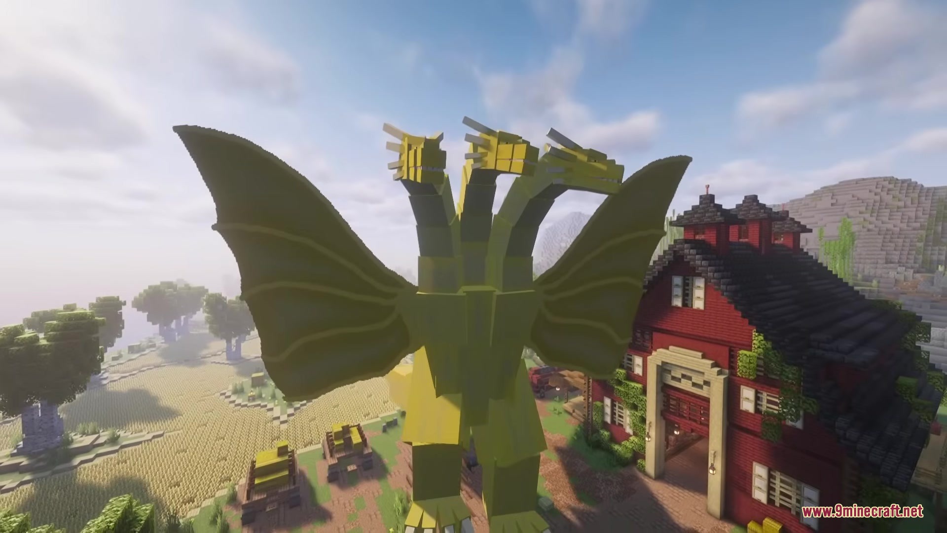 Godzilla Reborn Mod Screenshot 5 Giant King Ghidorah standing next to a red barn in a Minecraft world