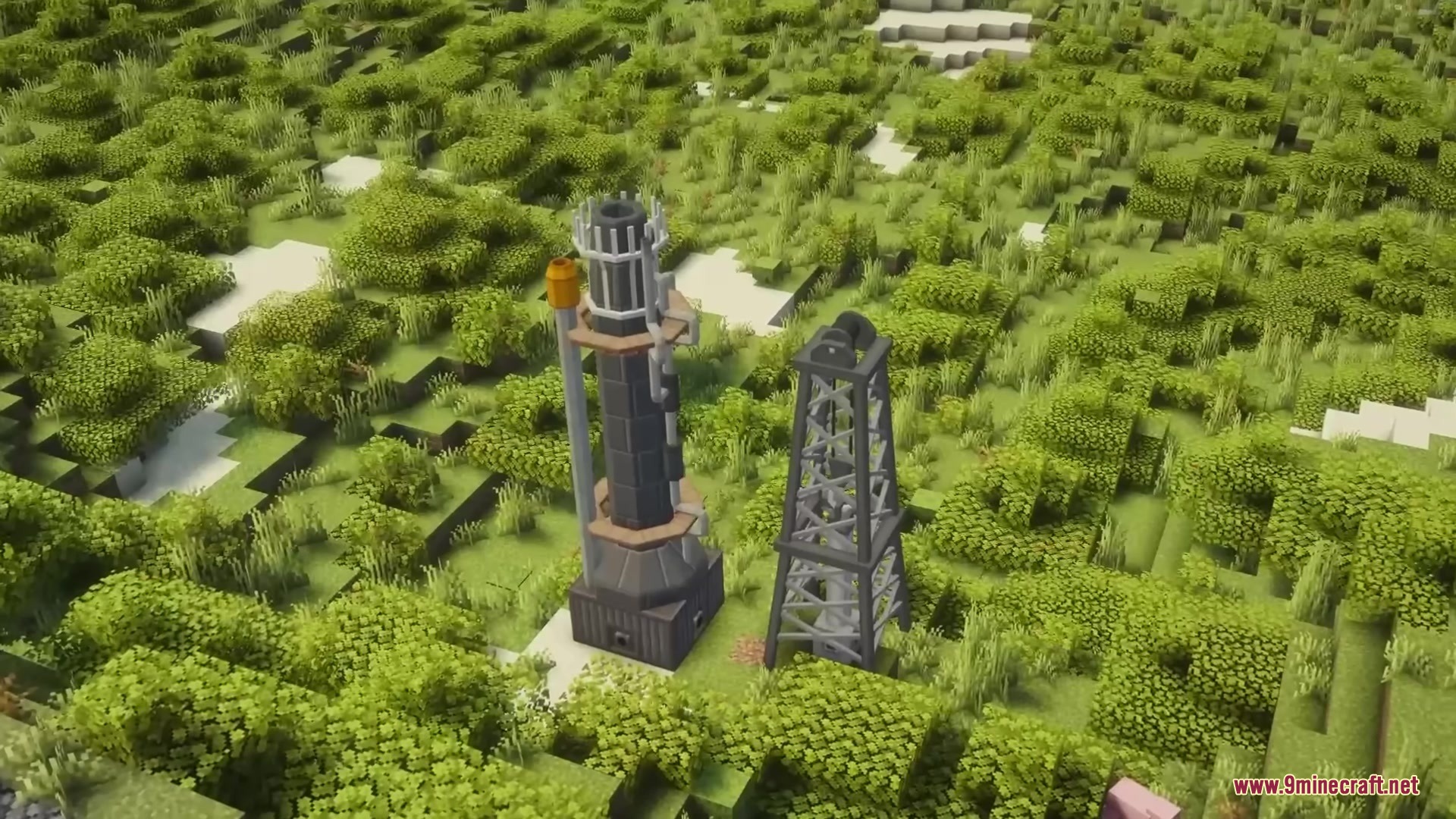 A large industrial refinery and oil derrick situated within a lush green forest