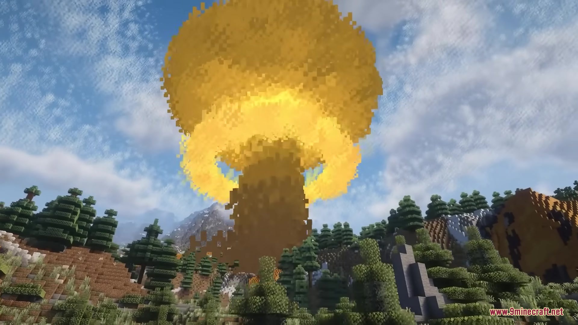A massive yellow mushroom cloud explosion towering over a forest and mountains