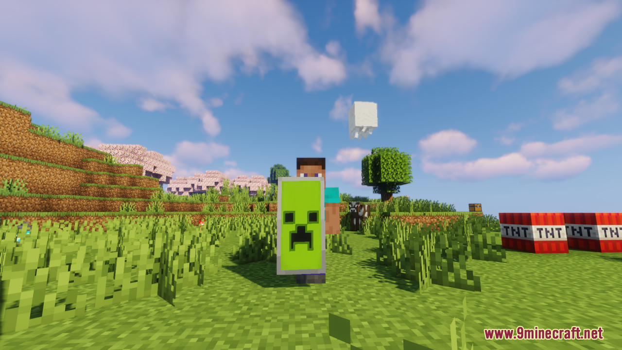 A Minecraft player holding a shield with a detailed green Creeper design