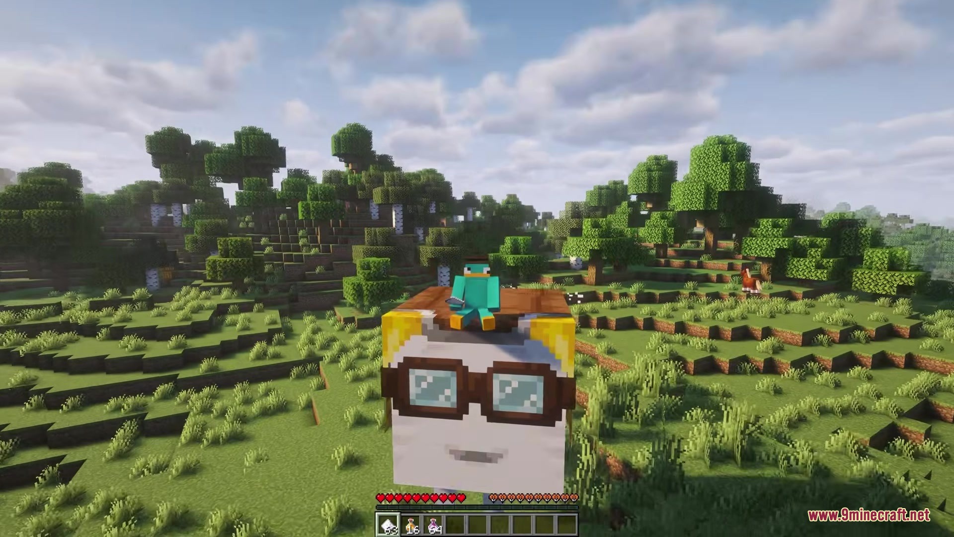 Player riding a custom ghast with goggles over a green forest landscape