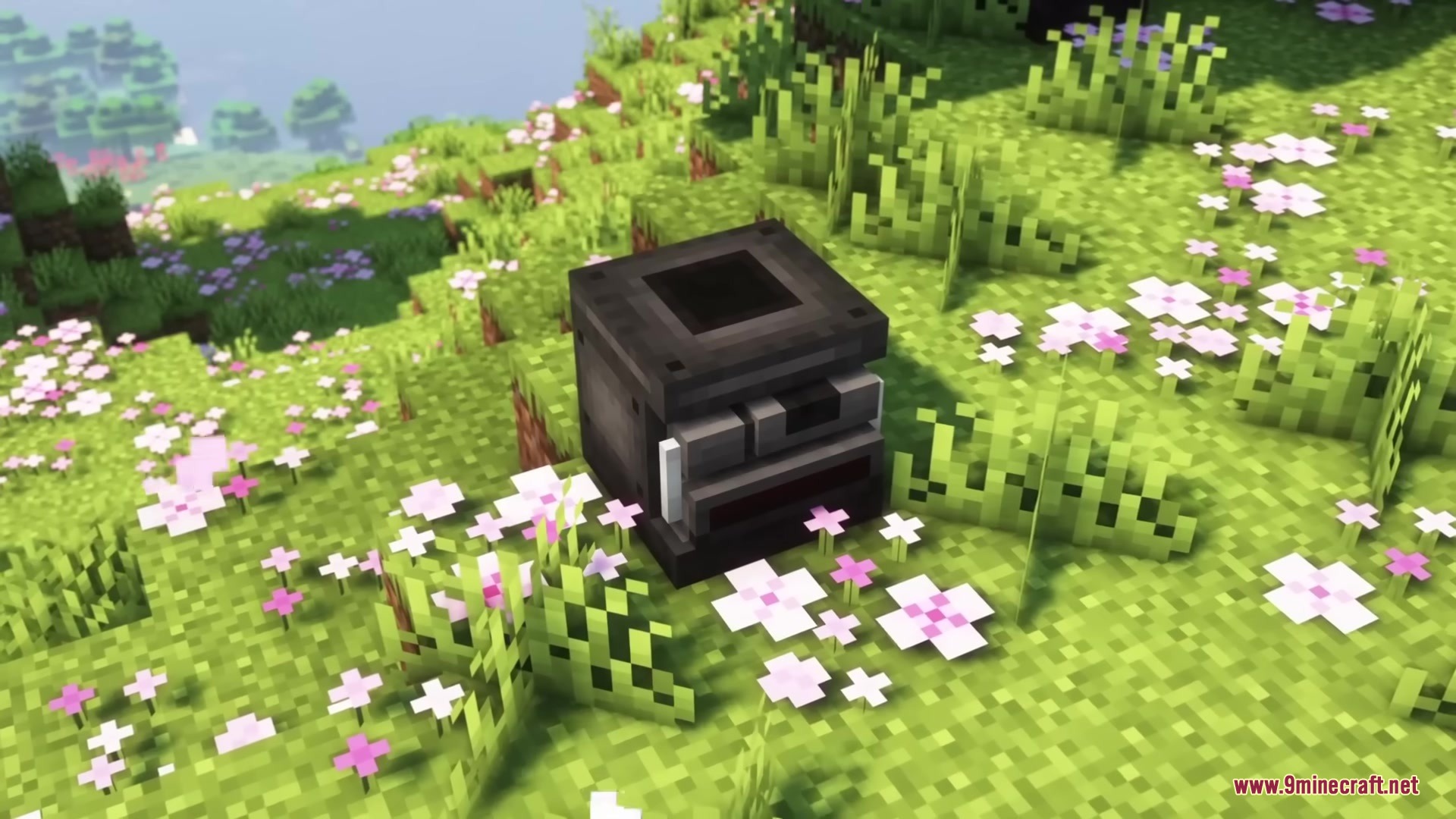 A medical processing machine with a hopper top on a grassy hill