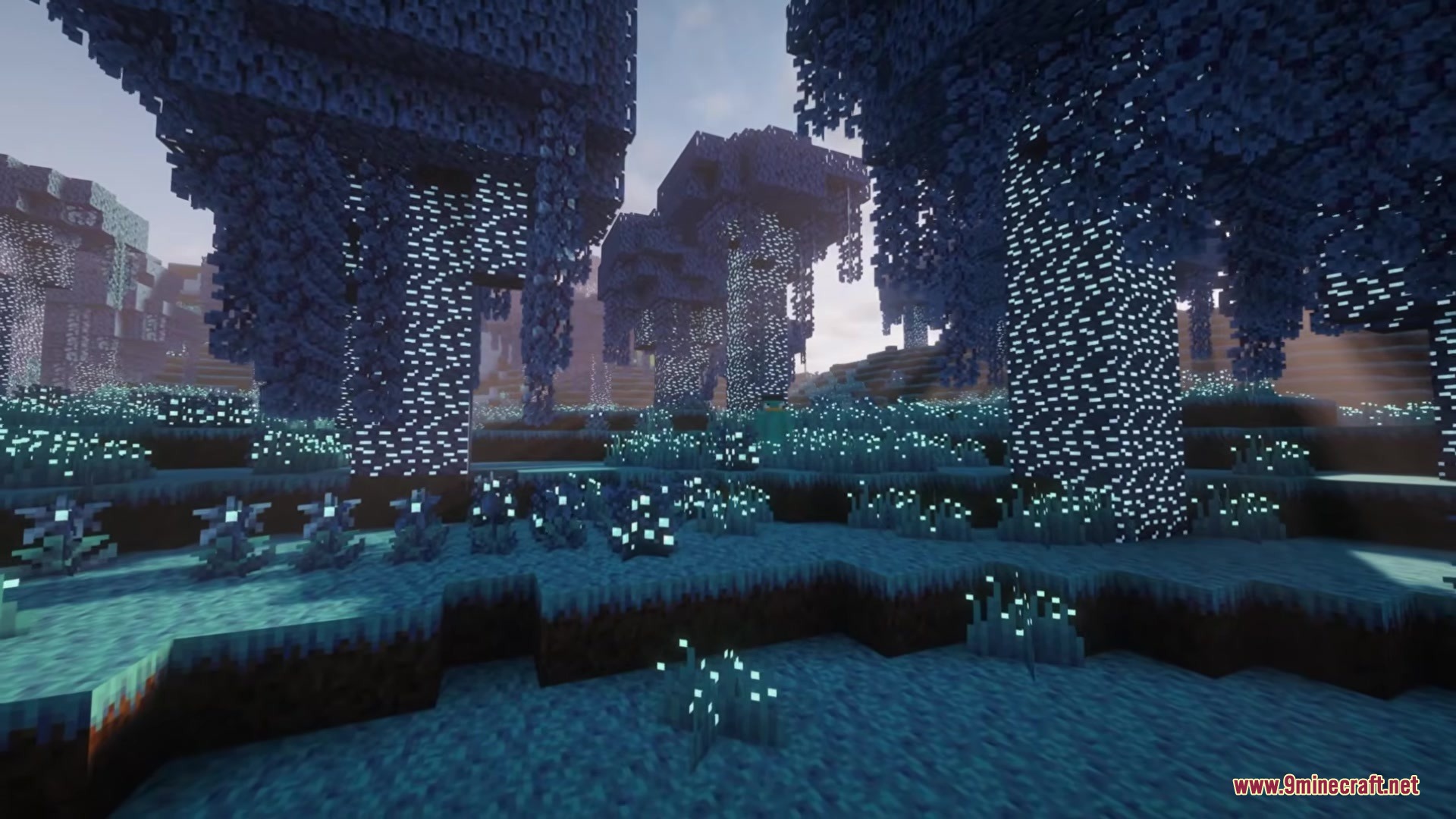 Hexforged Artifices Mod Screenshot 2 A dense forest filled with glowing blue trees and magical plants at night