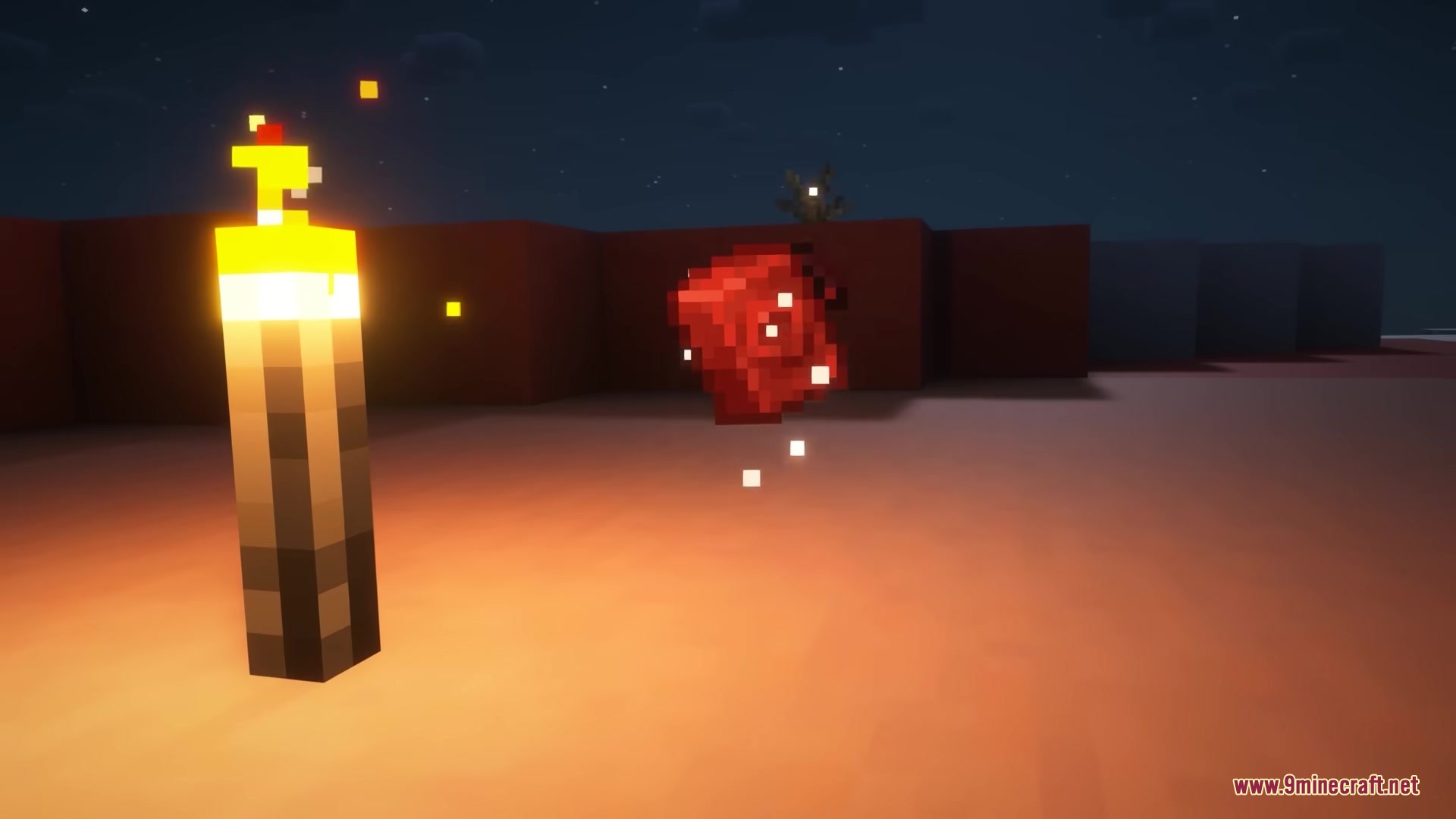 A red item floats in the air next to a glowing torch