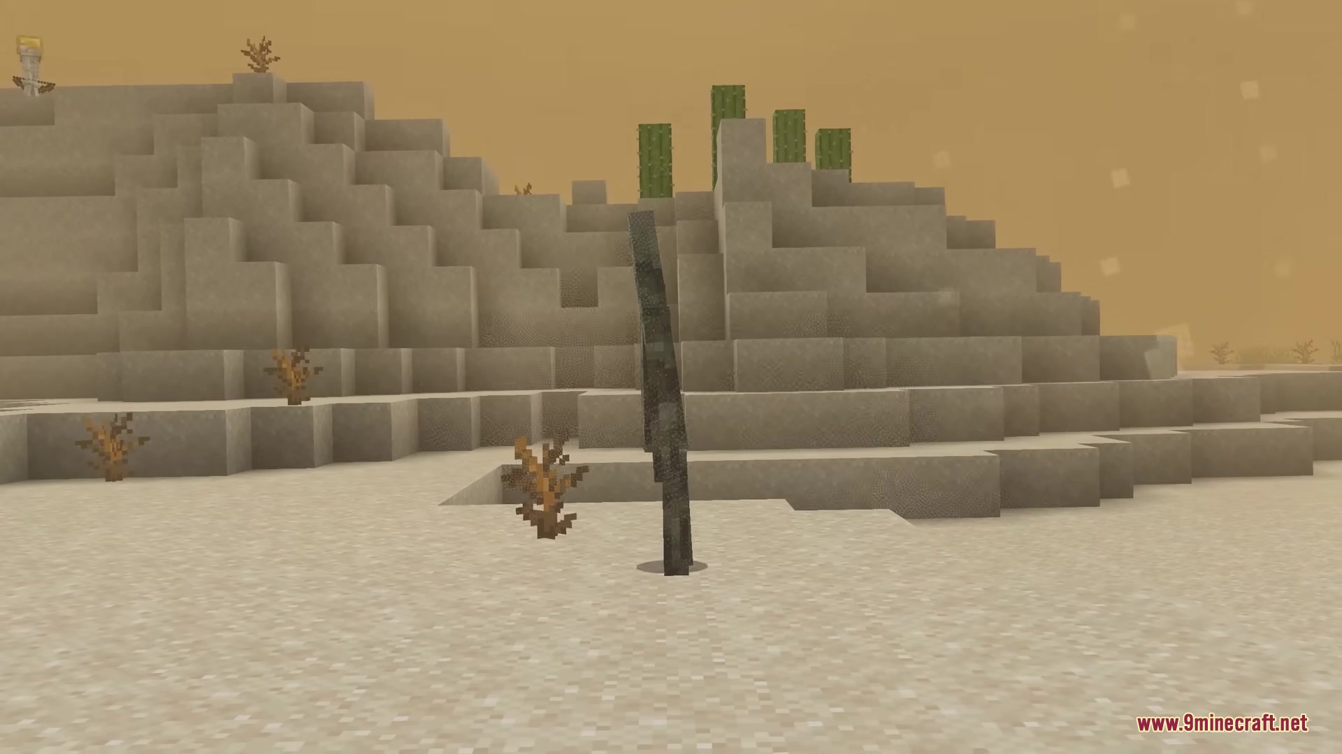 A tall Fossilized mob stands in a desert biome near sand hills