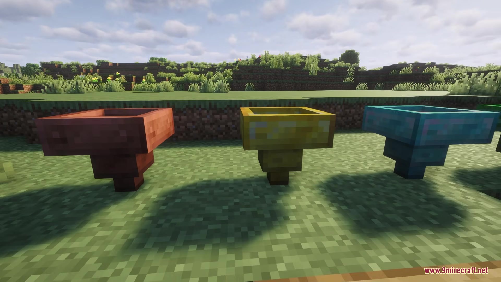 Hopper Plus Mod Screenshot 2 Three upgraded hoppers including copper gold and diamond versions on the grass
