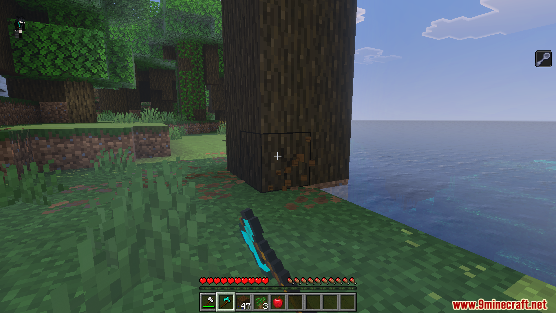 A player uses a diamond axe to break a dark oak tree