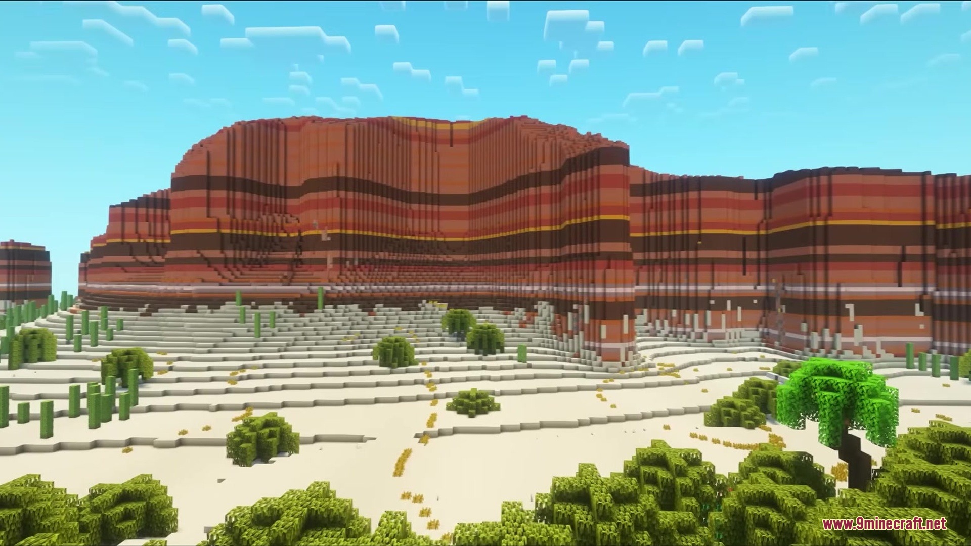 Hydrological Mod Screenshot 10 Massive layered mesa cliffs overlooking a desert biome with custom green bushes