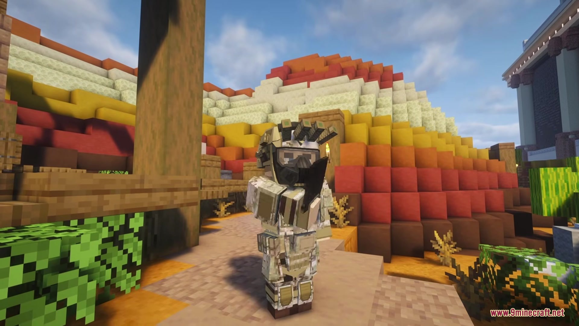 A Minecraft player wearing detailed military gear stands in a colorful desert landscape