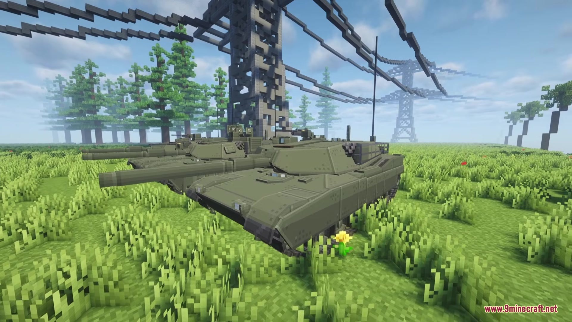 Two green military tanks parked in a grassy field under power lines