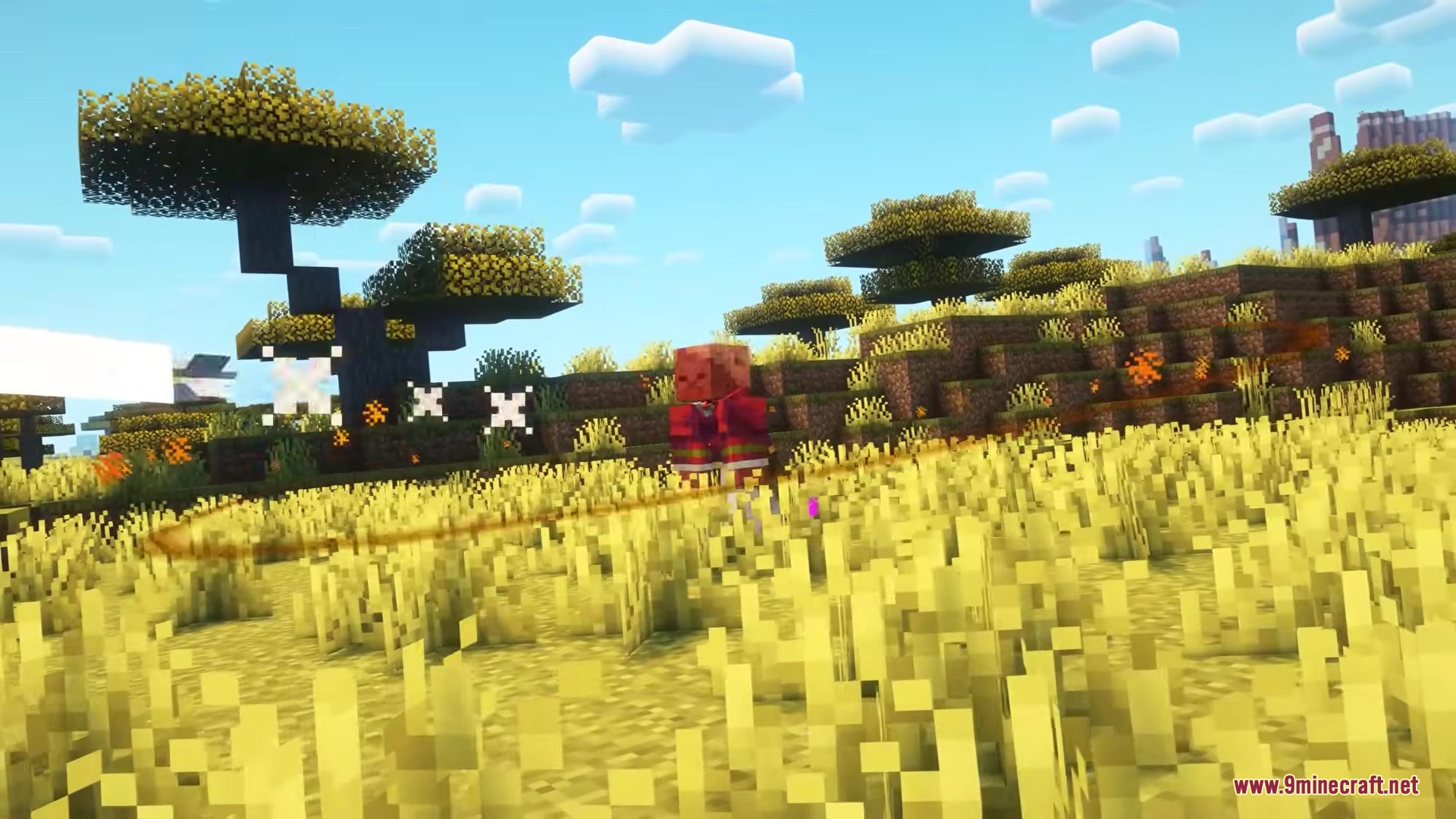 Iden's Decor Mod Screenshot 8 A player in a red outfit stands in a savanna with yellow particles