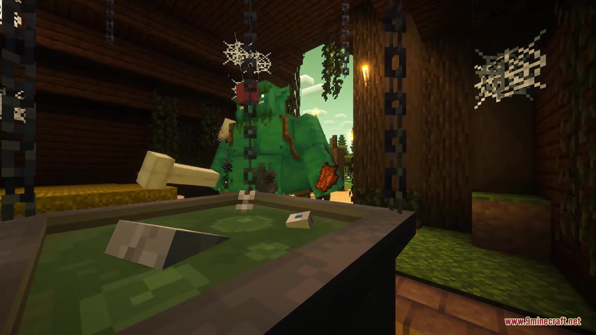 Inhabitants Mod Screenshot 9 A large green Bogre stands near a cauldron inside a dark swamp hut