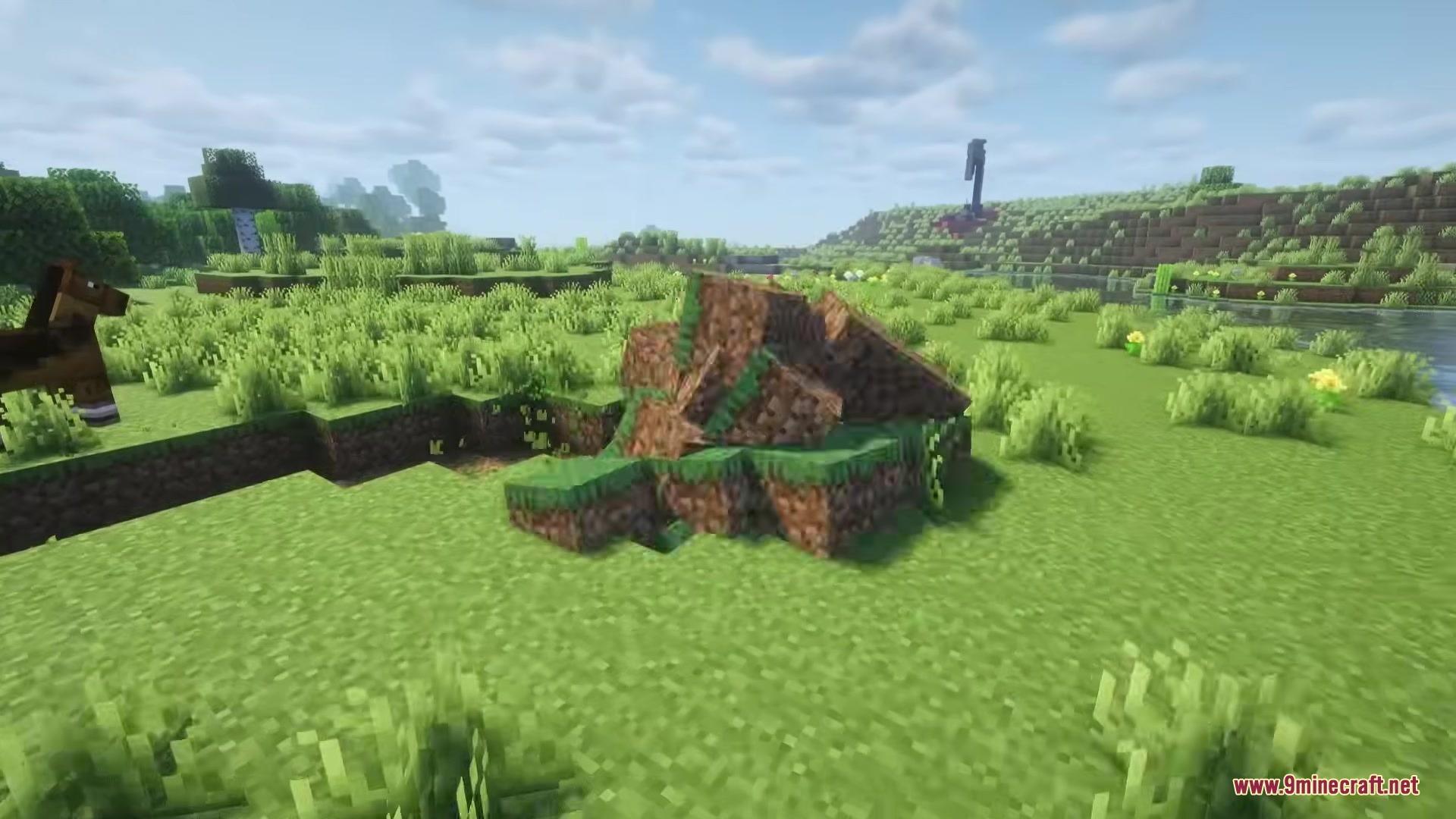 Katamari Mod Screenshot 1 A large pile of dirt and grass blocks clumped together in the field