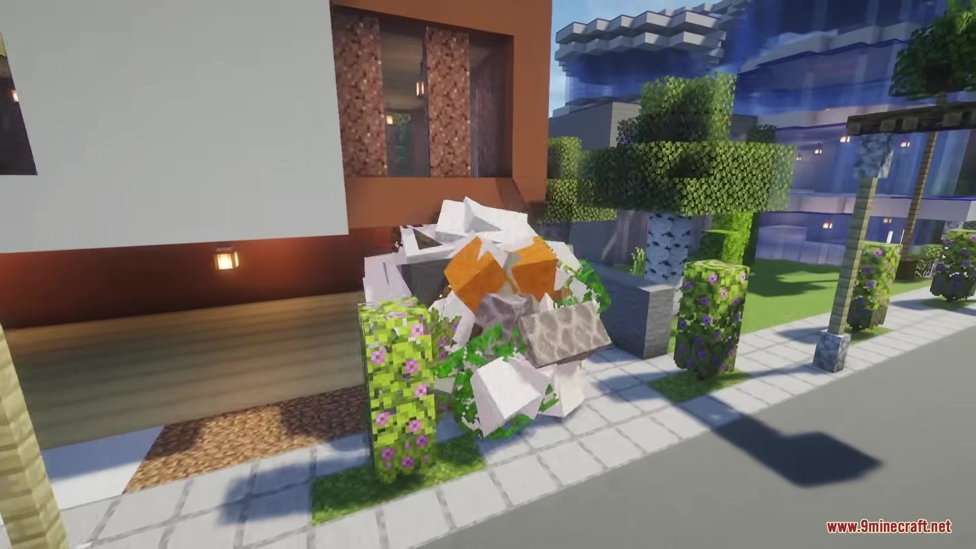 Katamari Mod Screenshot 10 A sphere of collected blocks rolls past a modern house and garden
