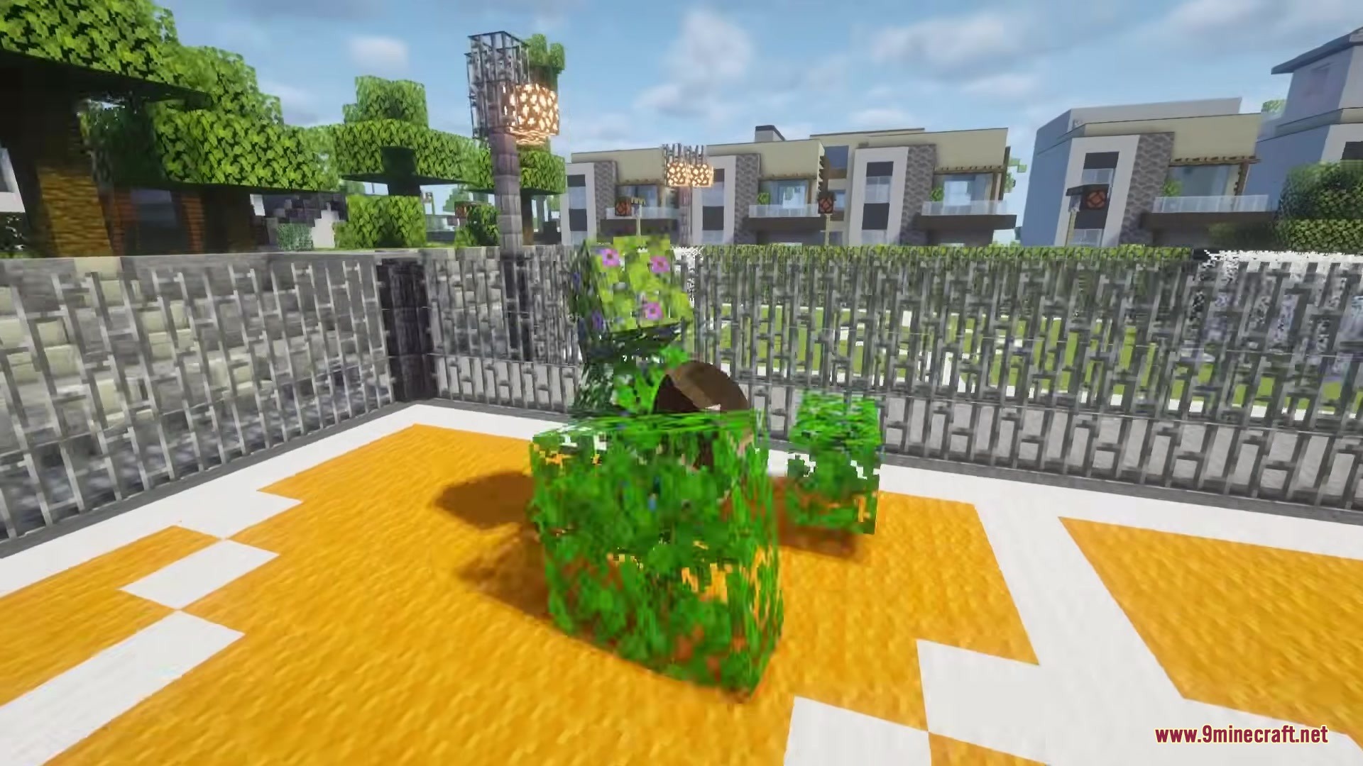 Katamari Mod Screenshot 8 A player character transformed into a ball covered in leaf blocks on orange wool