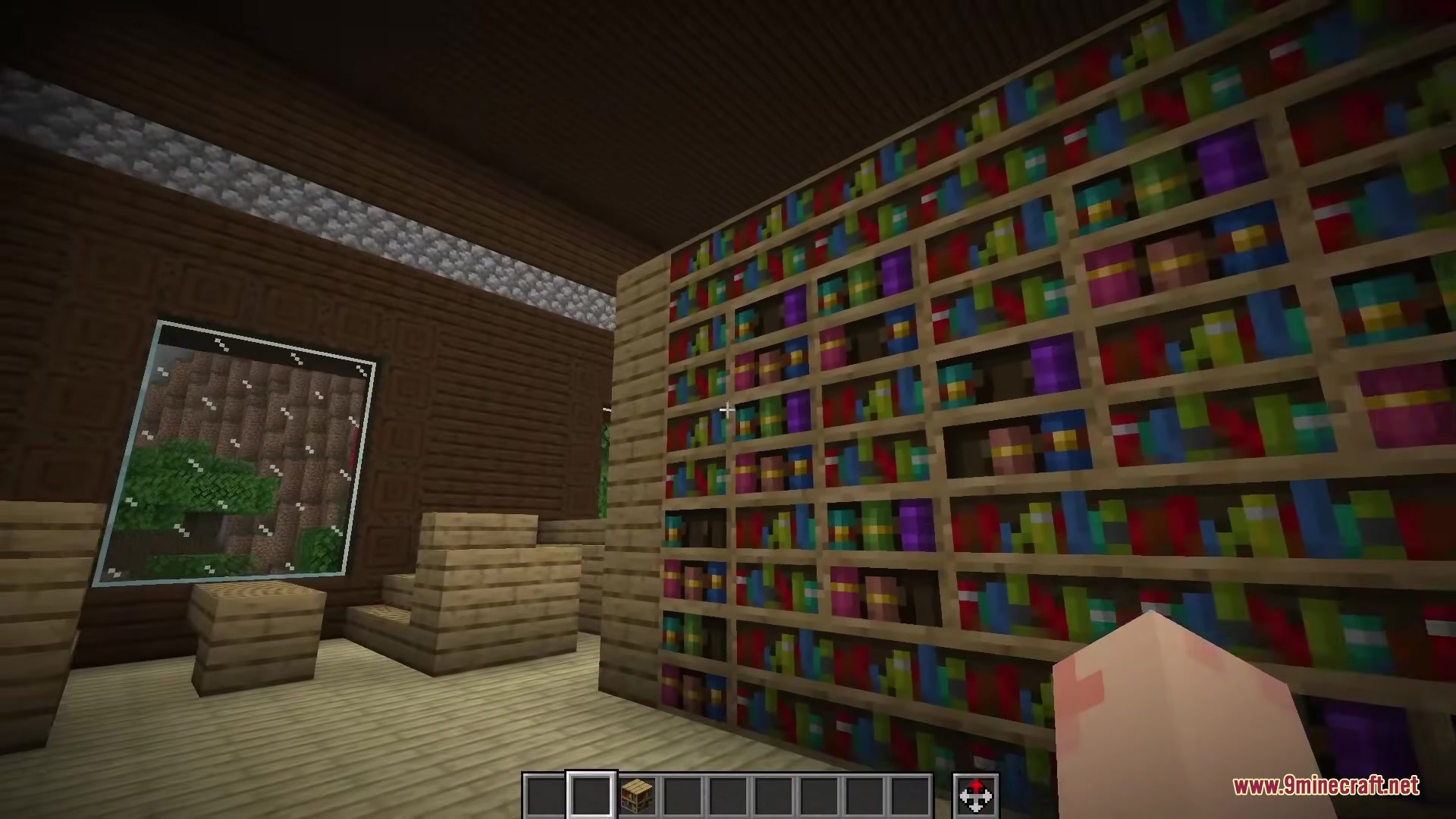 A large wall of detailed bookshelves inside a wooden Minecraft room