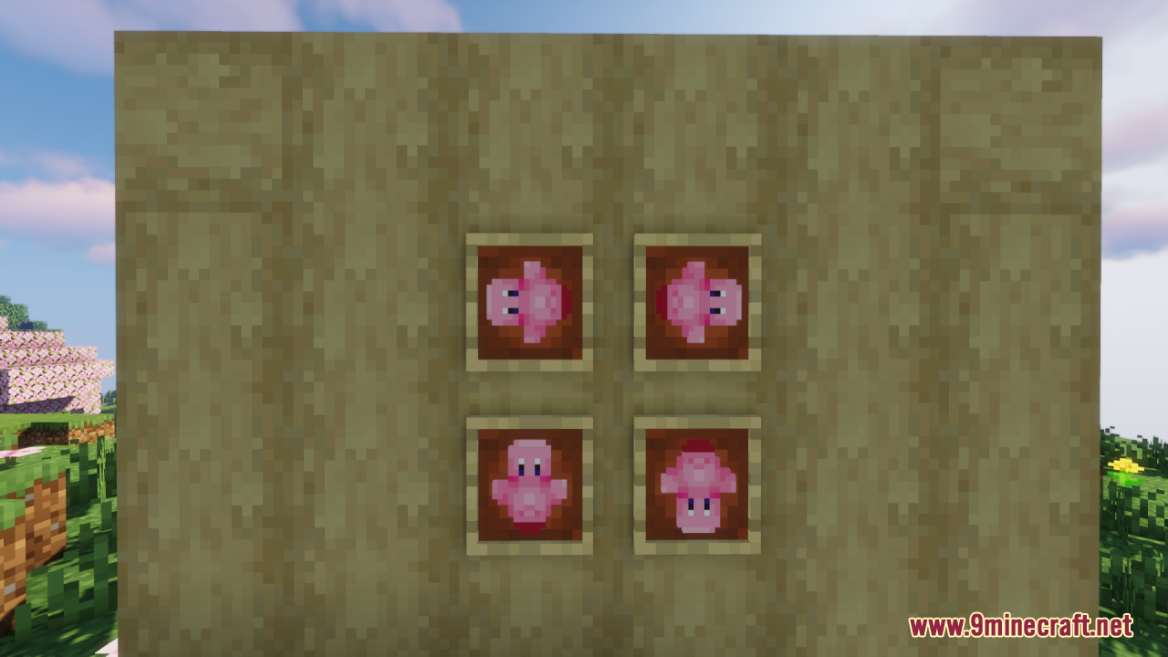 Four pink Kirby items displayed in item frames on a wooden wall