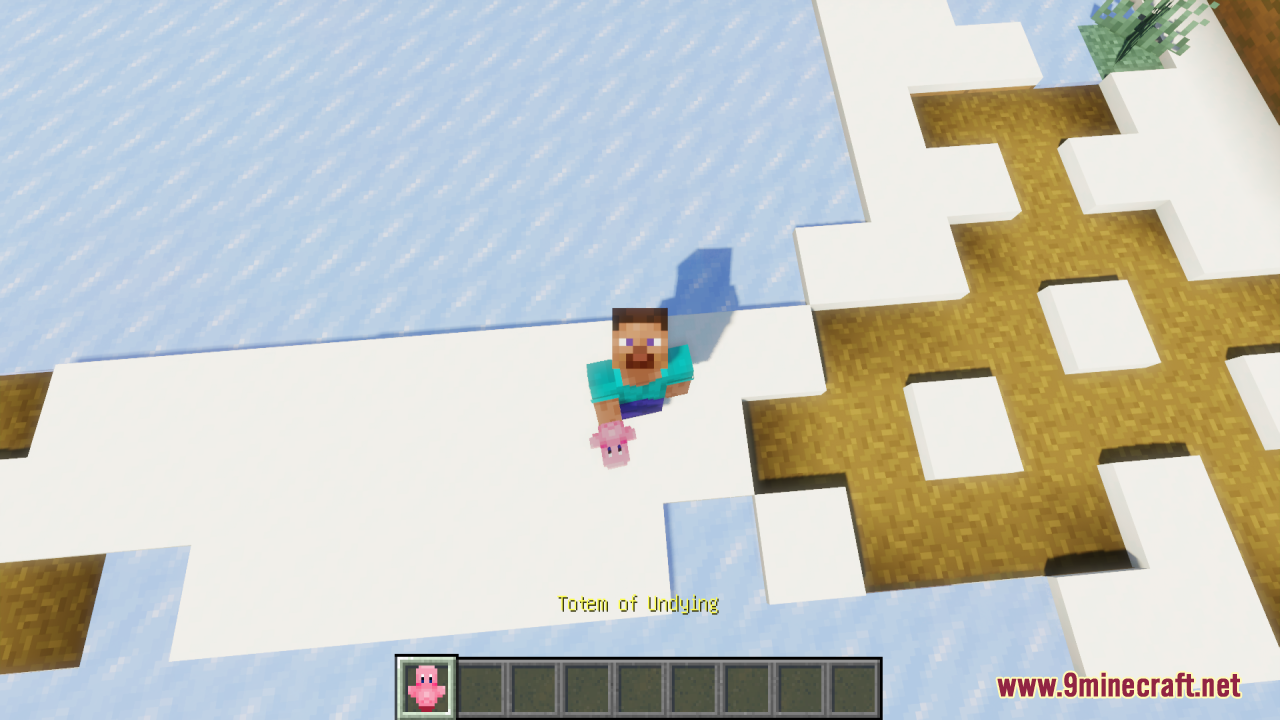 A Minecraft player holding a pink Kirby totem while standing on the snow