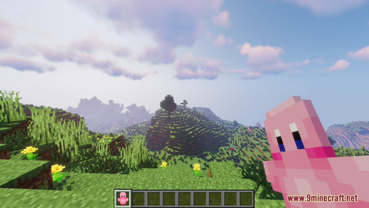 Player holding a pink Kirby Totem of Undying while looking at a hill