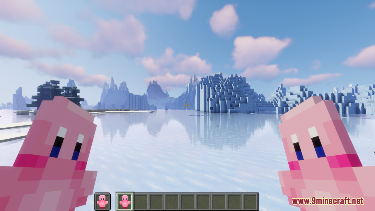 Player holding two pink Kirby Totems of Undying while standing in a frozen biome