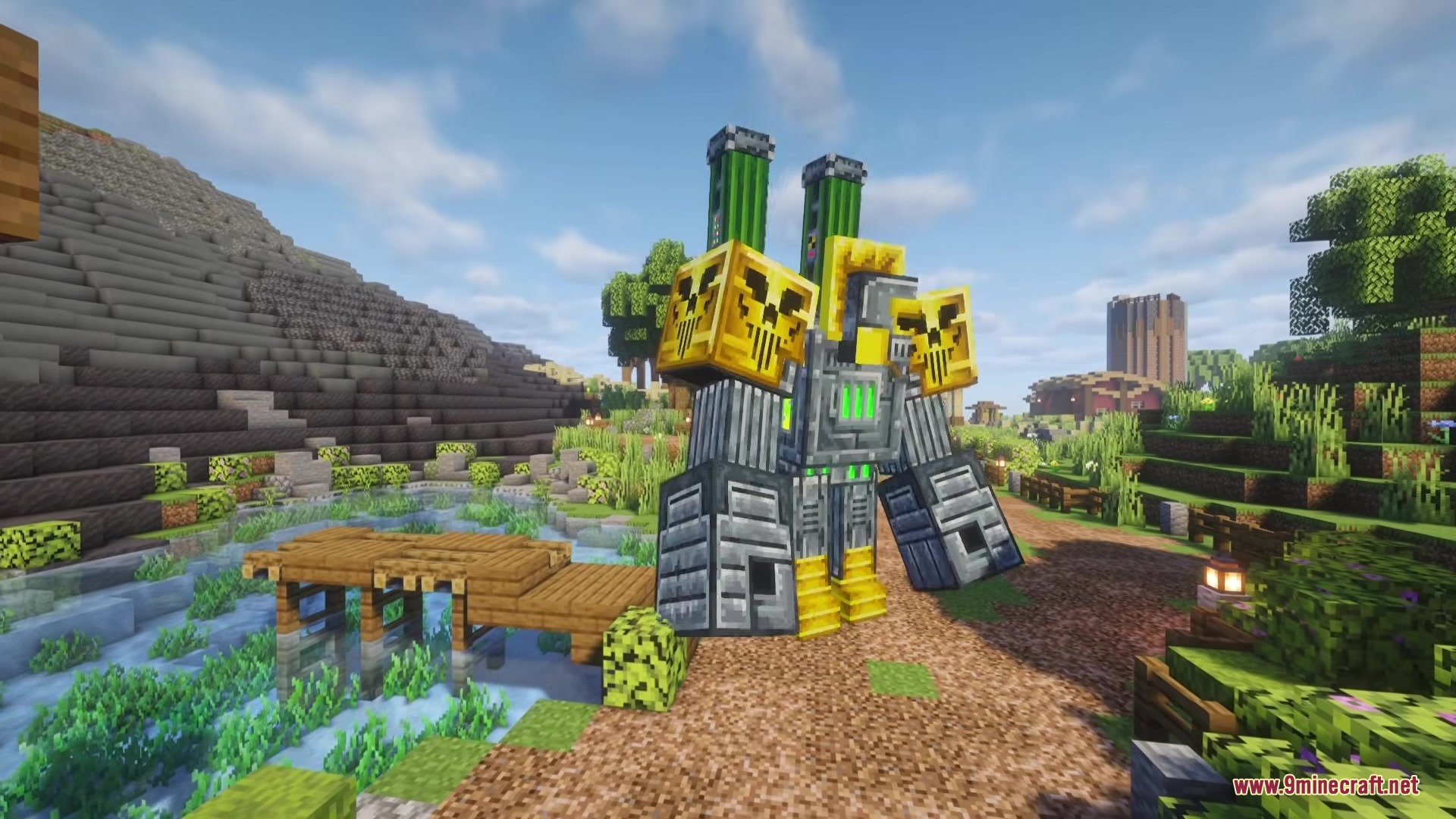 The massive Grugantuar robot stands on a path near a wooden bridge