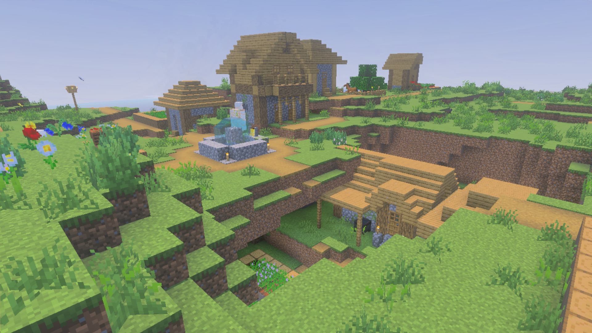 Village buildings and a fountain in daylight showing the La Nature block textures