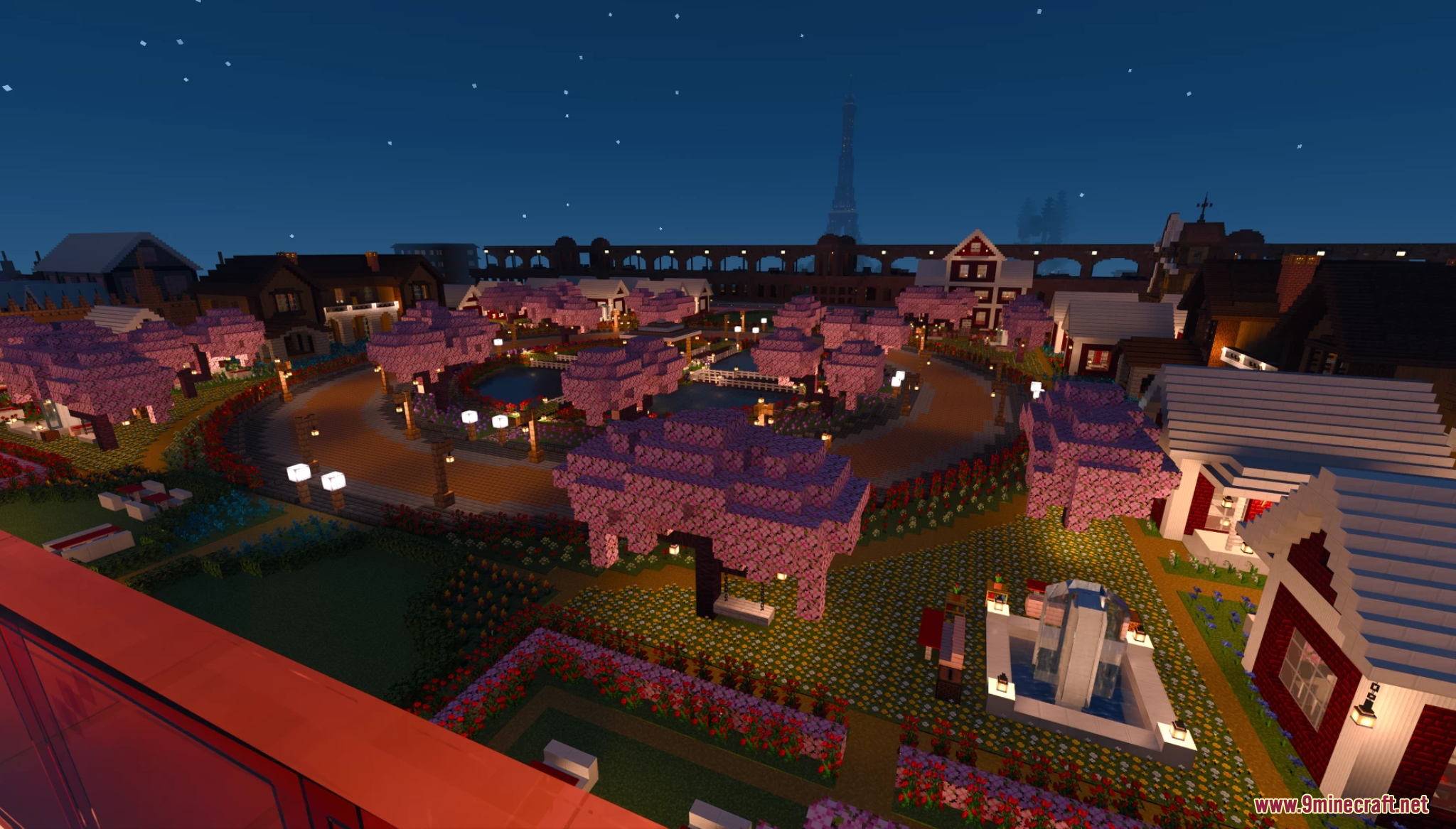 Lake Towen Map Screenshot 6 Aerial view of a town at night with cherry blossom trees and fountains