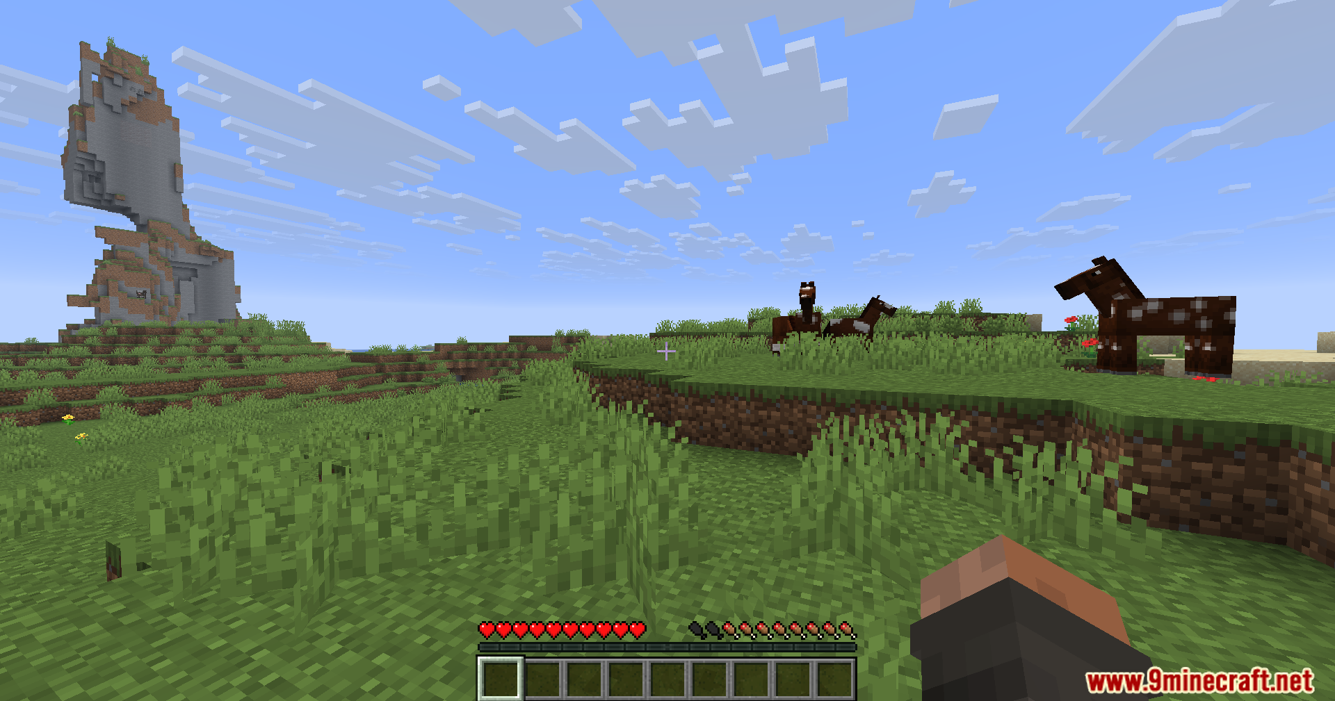 Lightning Grim Anticheat Mod Screenshot 12 Horses standing in a field with a tall mountain in the distance