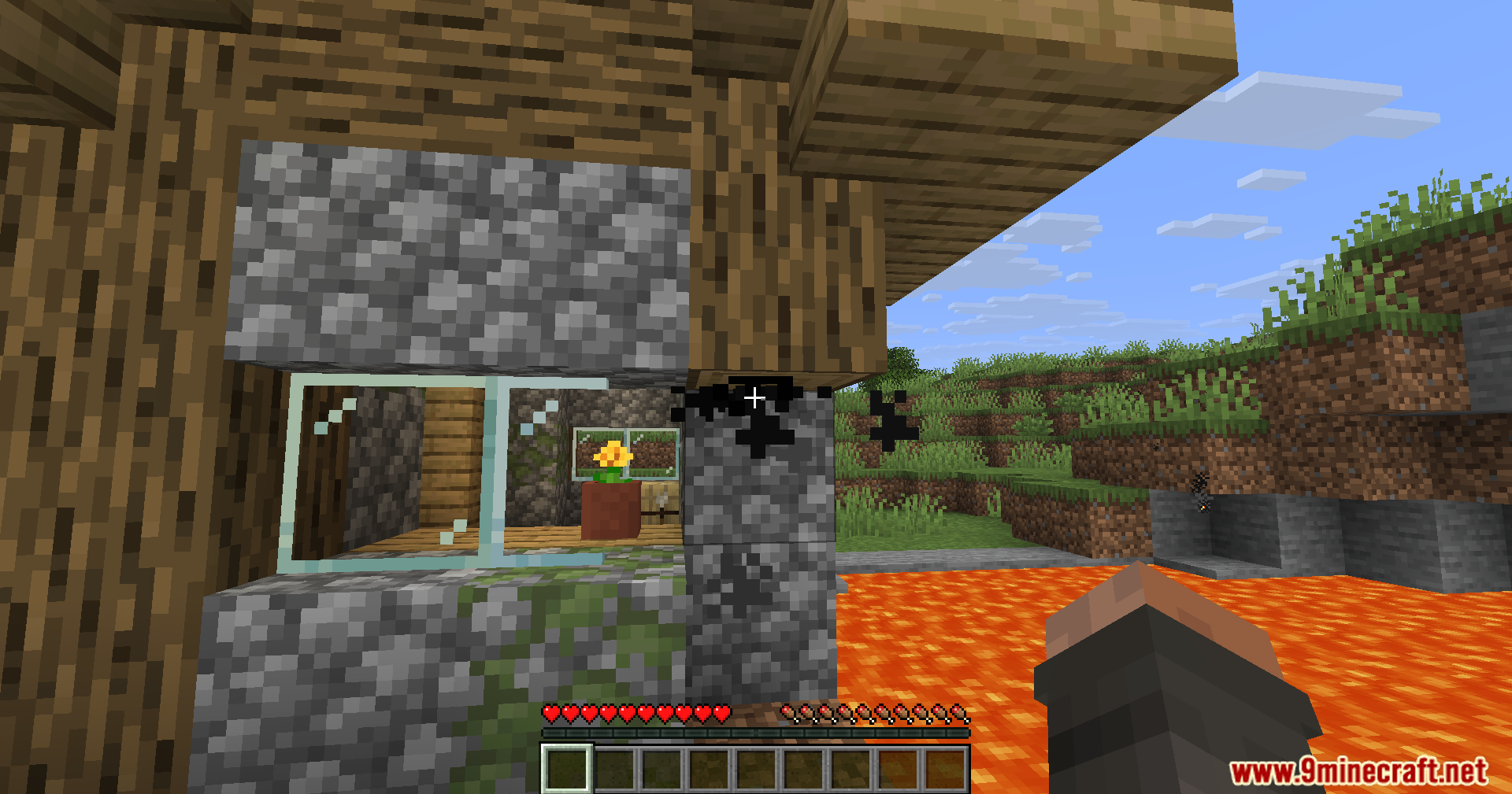 Lightning Grim Anticheat Mod Screenshot 5 A player looking at a cobblestone wall with black particles and lava nearby