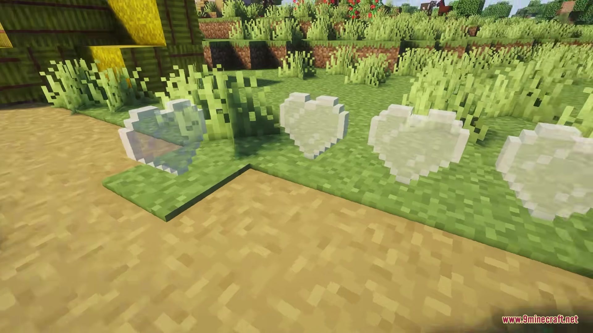 Love Core Mod Screenshot 11 Heart shaped glass blocks placed on green grass in Minecraft