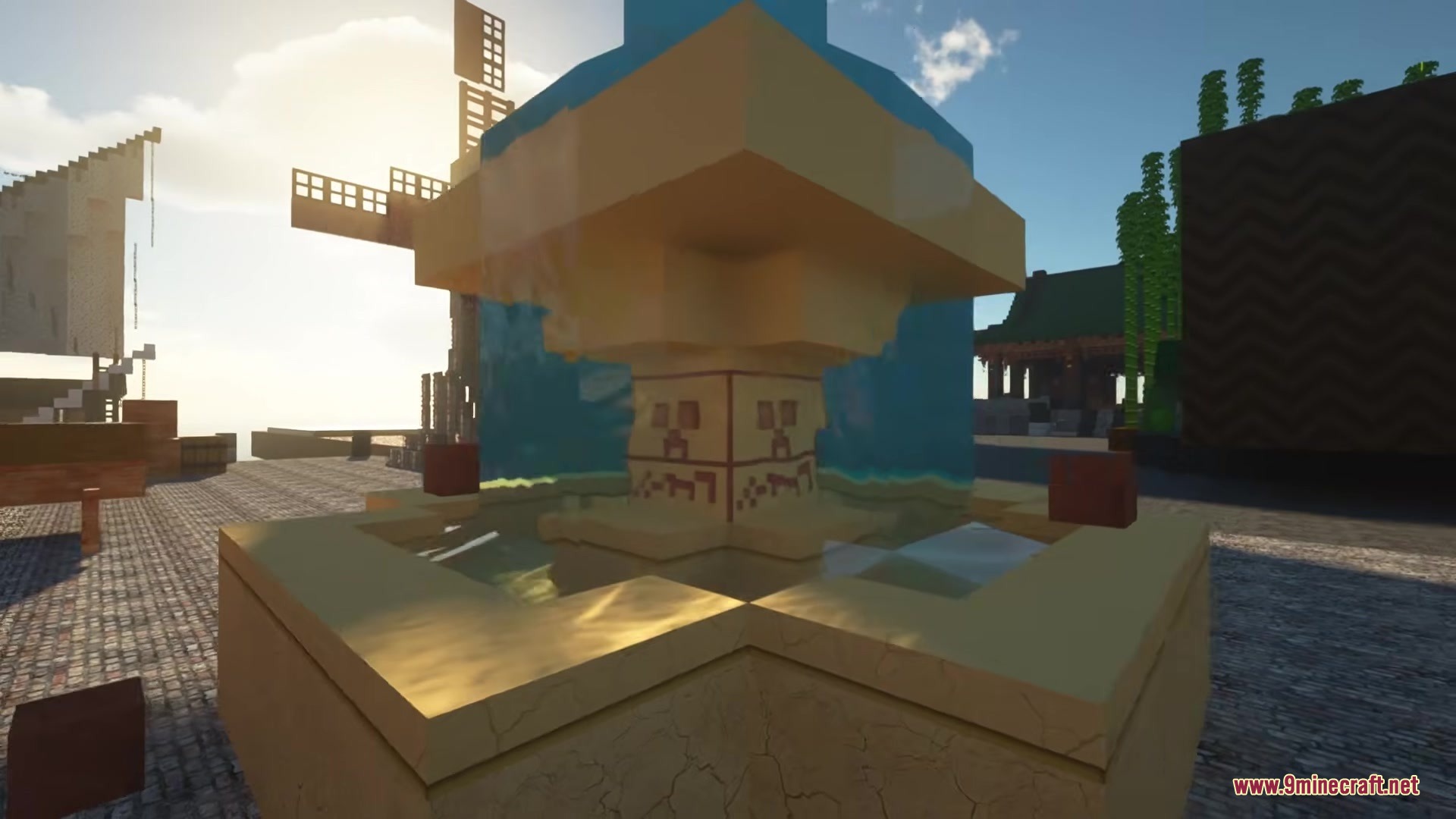 Luna HD 64x Resource Pack Screenshot 3 A detailed stone fountain with flowing water and realistic textures under bright sunlight