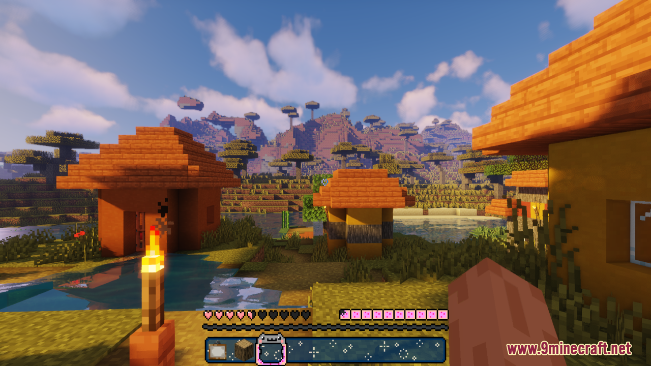 Savanna village view featuring a custom pink heart and hunger bar interface
