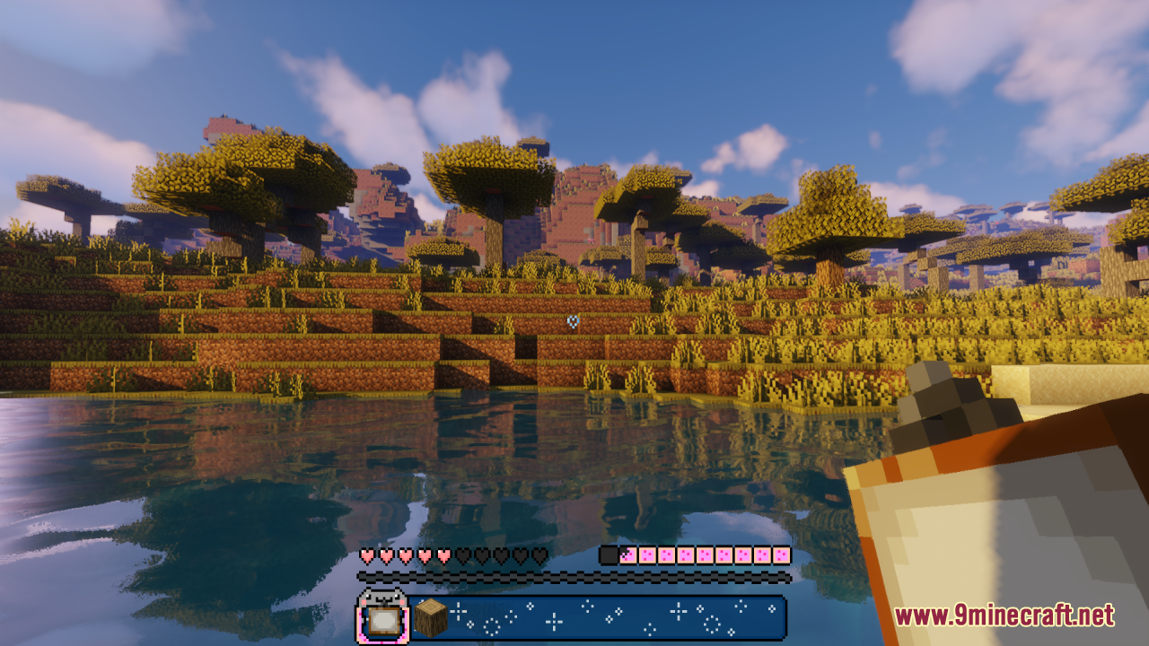 Minecraft savanna landscape featuring a colorful Nyan Cat themed hotbar and lake