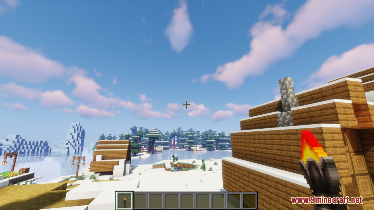 Lz Rustic Torch Resource Pack Screenshot 6 A player holding a rustic torch while exploring a snowy village