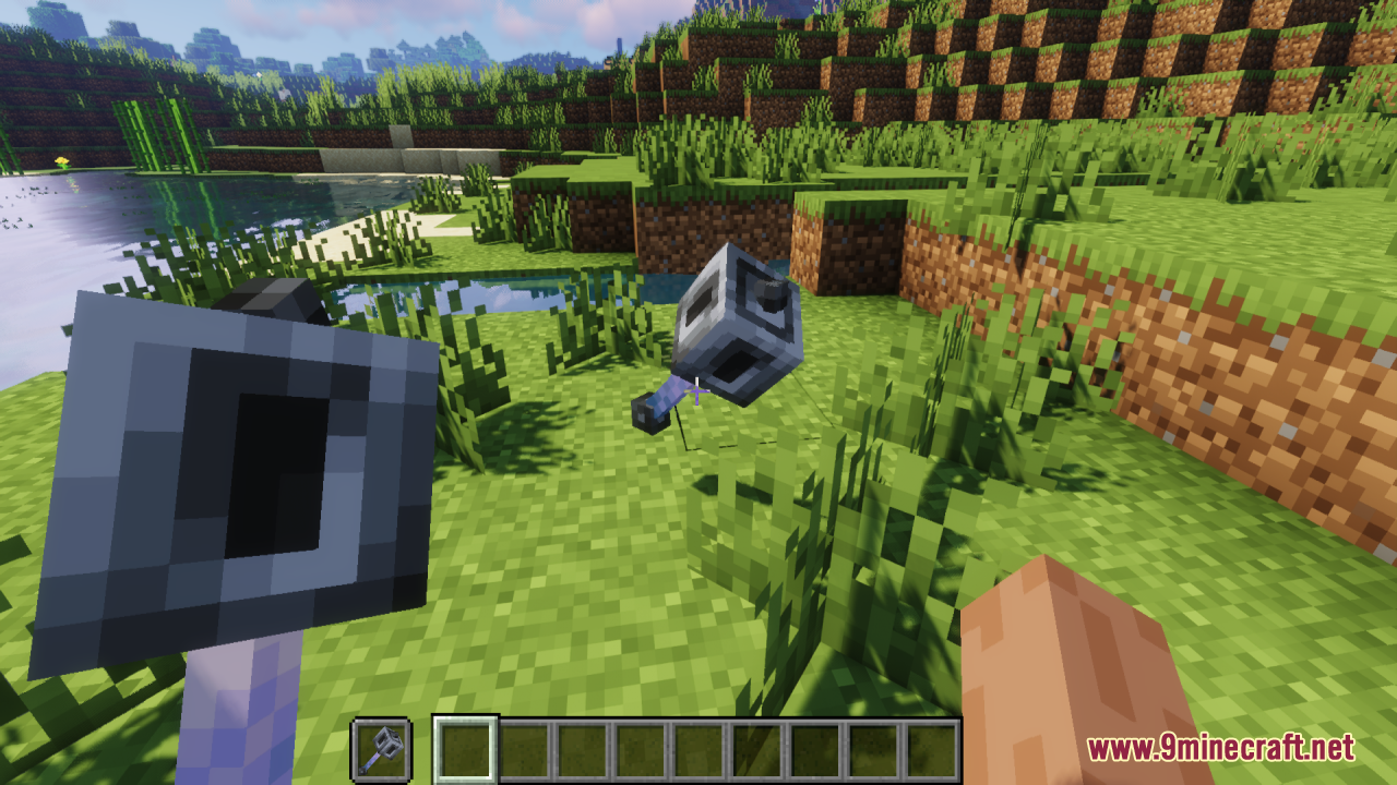 Mace 3D Item Resource Pack Screenshot 10 Player holding a blocky 3D mace with another one lying on the grass
