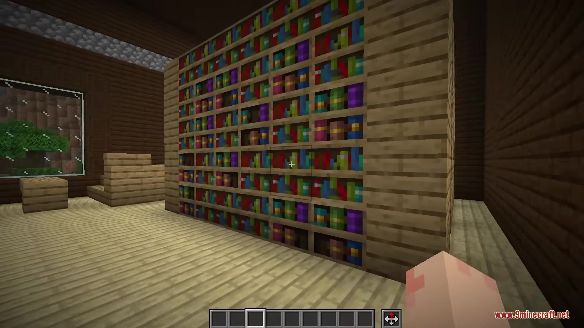A large library wall made of bookshelves in a Minecraft house