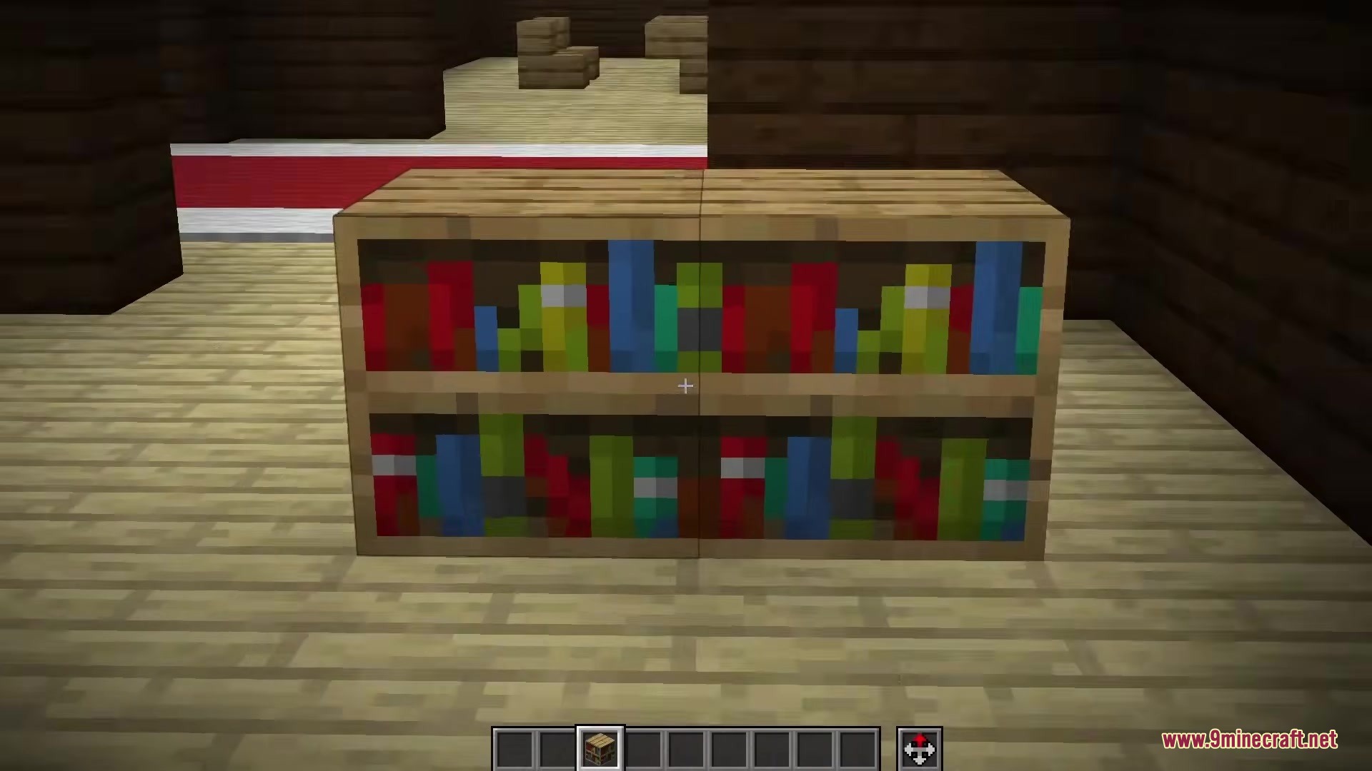 Two bookshelf blocks sitting on a light colored wooden floor