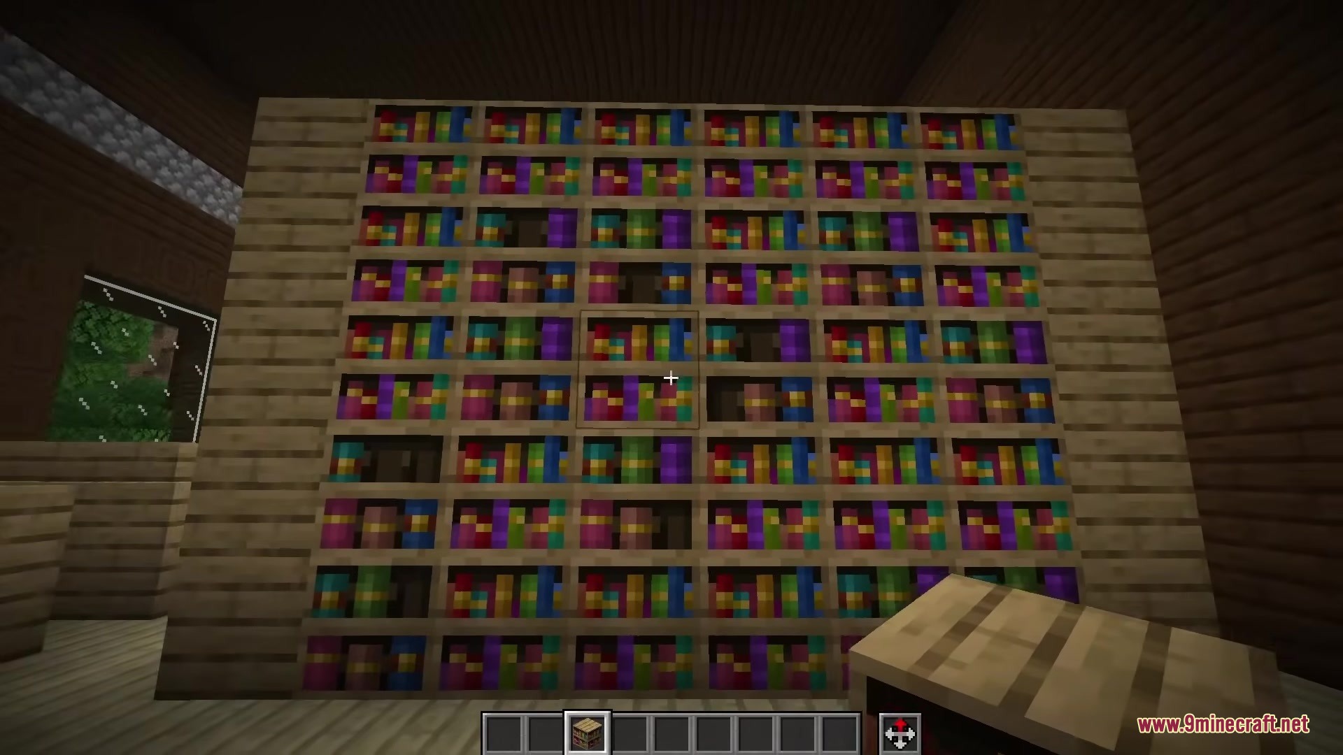 A large wall of bookshelves inside a wooden building in Minecraft