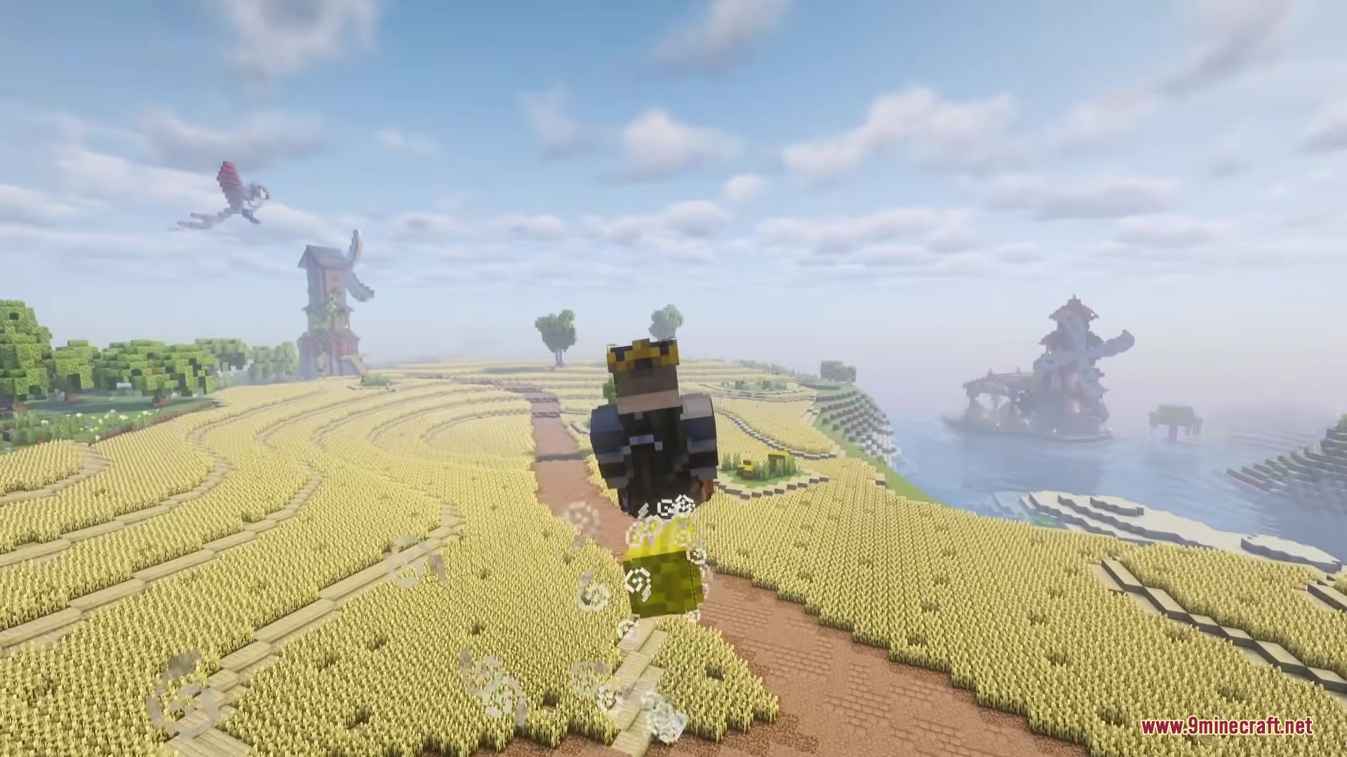 Magic Brooms Mod Screenshot 4 Player flying a broomstick over a scenic wheat field near the ocean