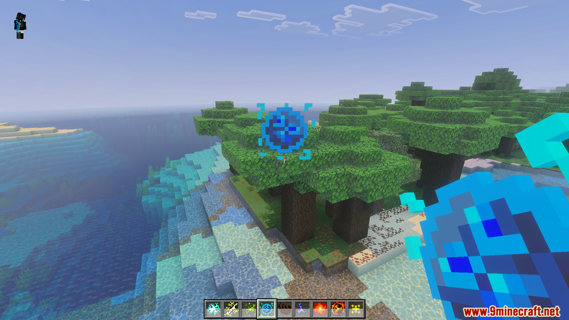 Magic Expansion Addon Screenshot 2 Player holding a blue magic orb with various spells in the hotbar